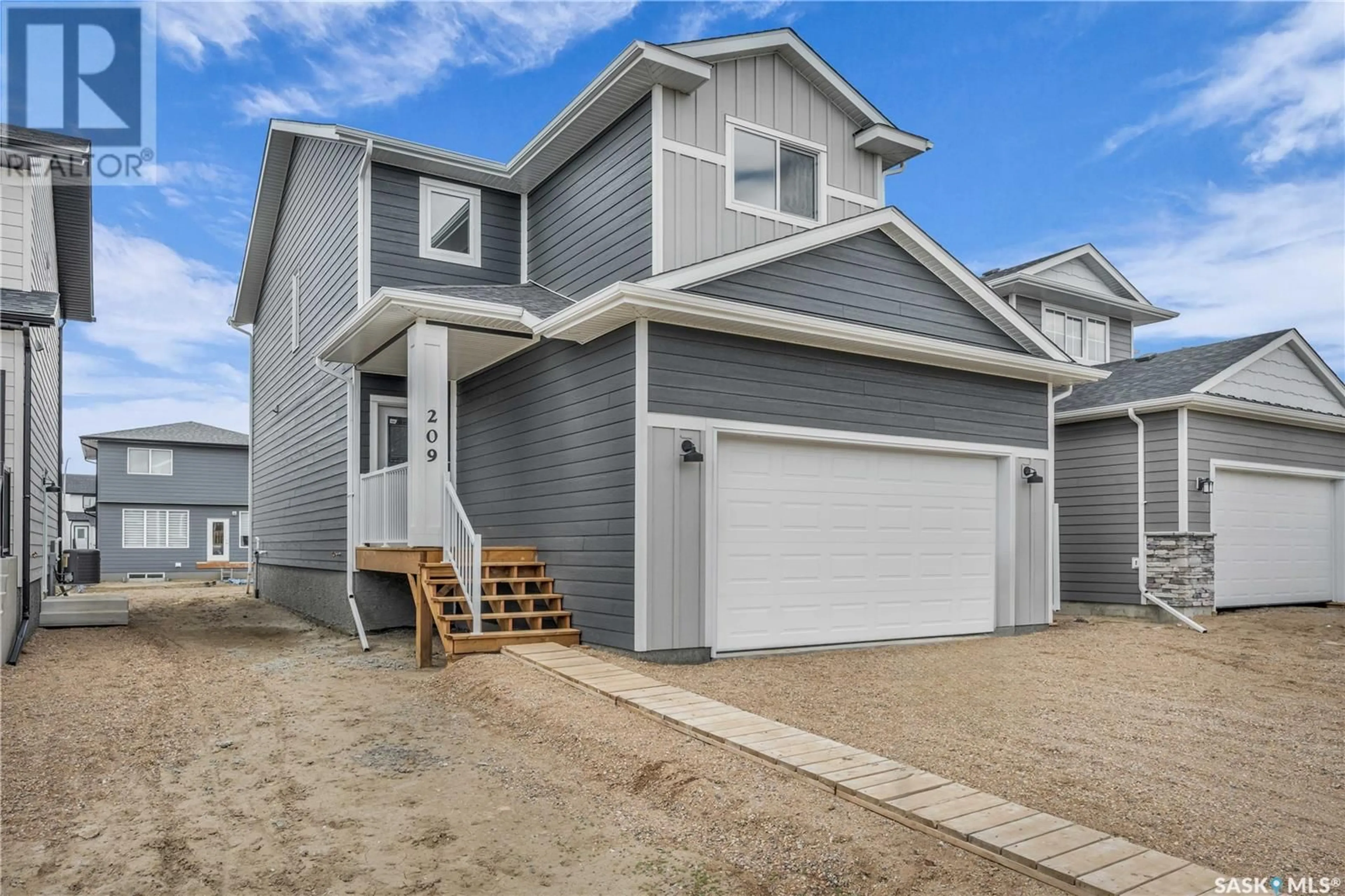 Home with vinyl exterior material, street for 171 DORAN WAY, Saskatoon Saskatchewan S7V0Z7