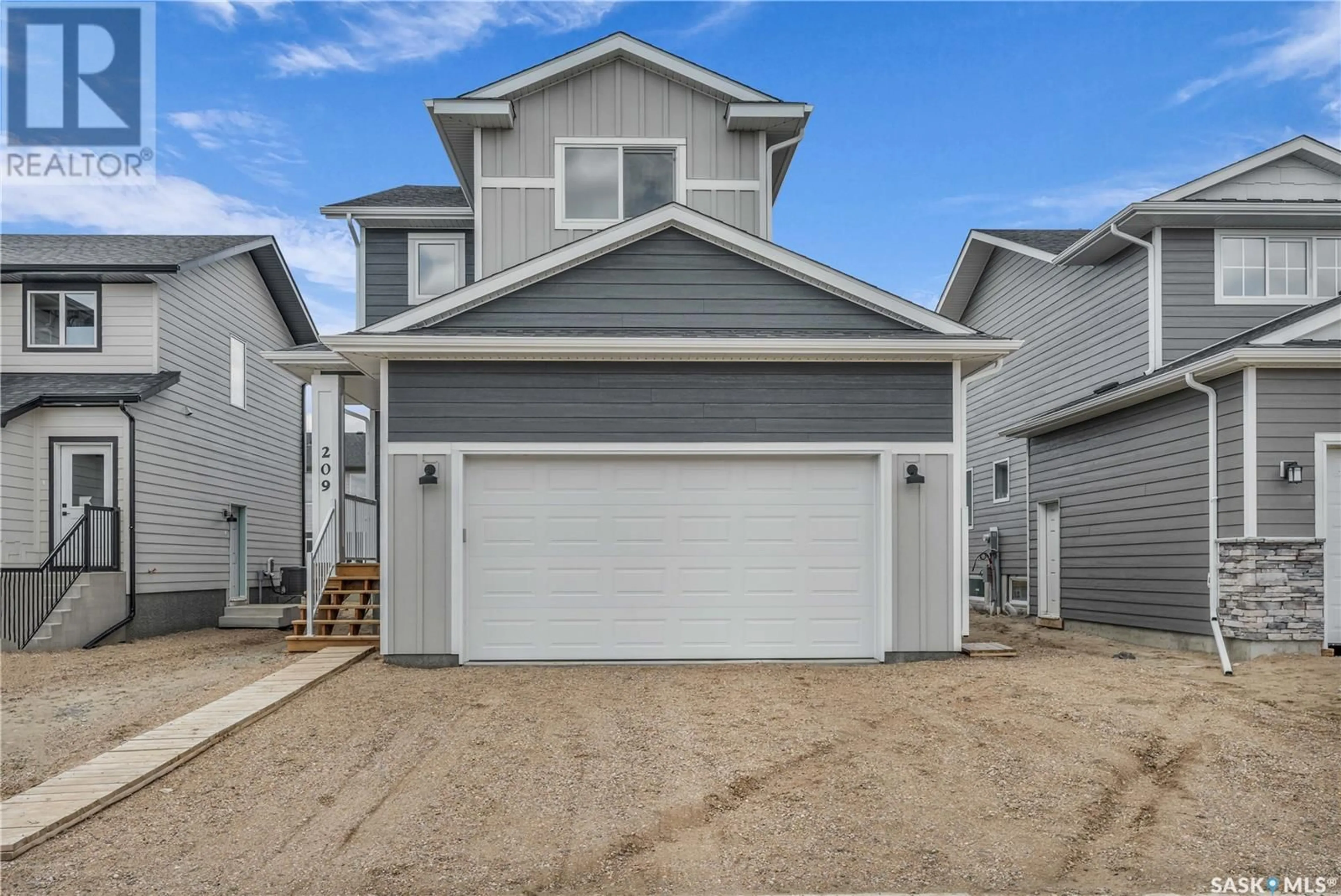 Home with vinyl exterior material, street for 178 DORAN WAY, Saskatoon Saskatchewan S7V0Z7