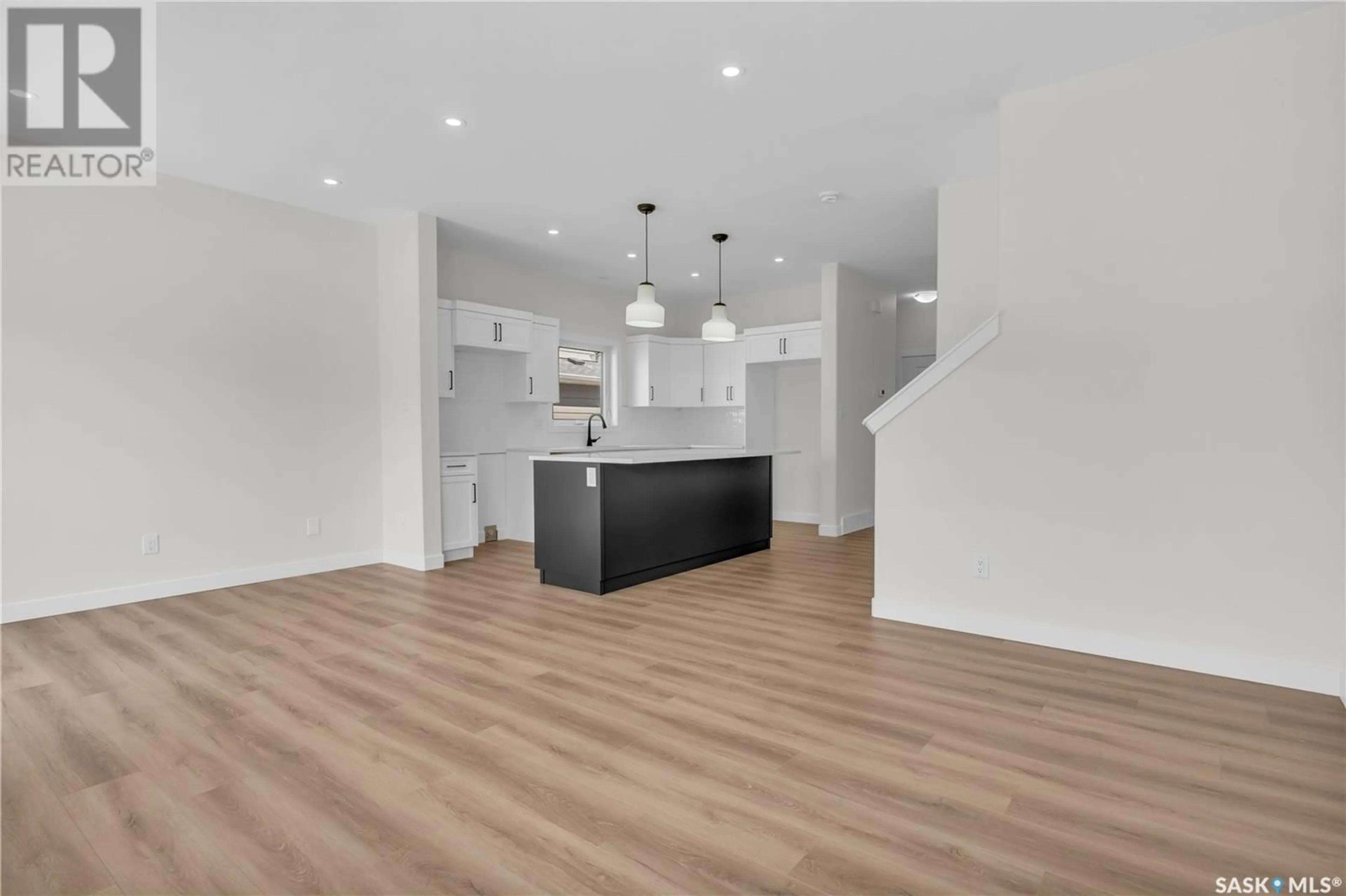 Open concept kitchen, wood/laminate floor for 178 DORAN WAY, Saskatoon Saskatchewan S7V0Z7