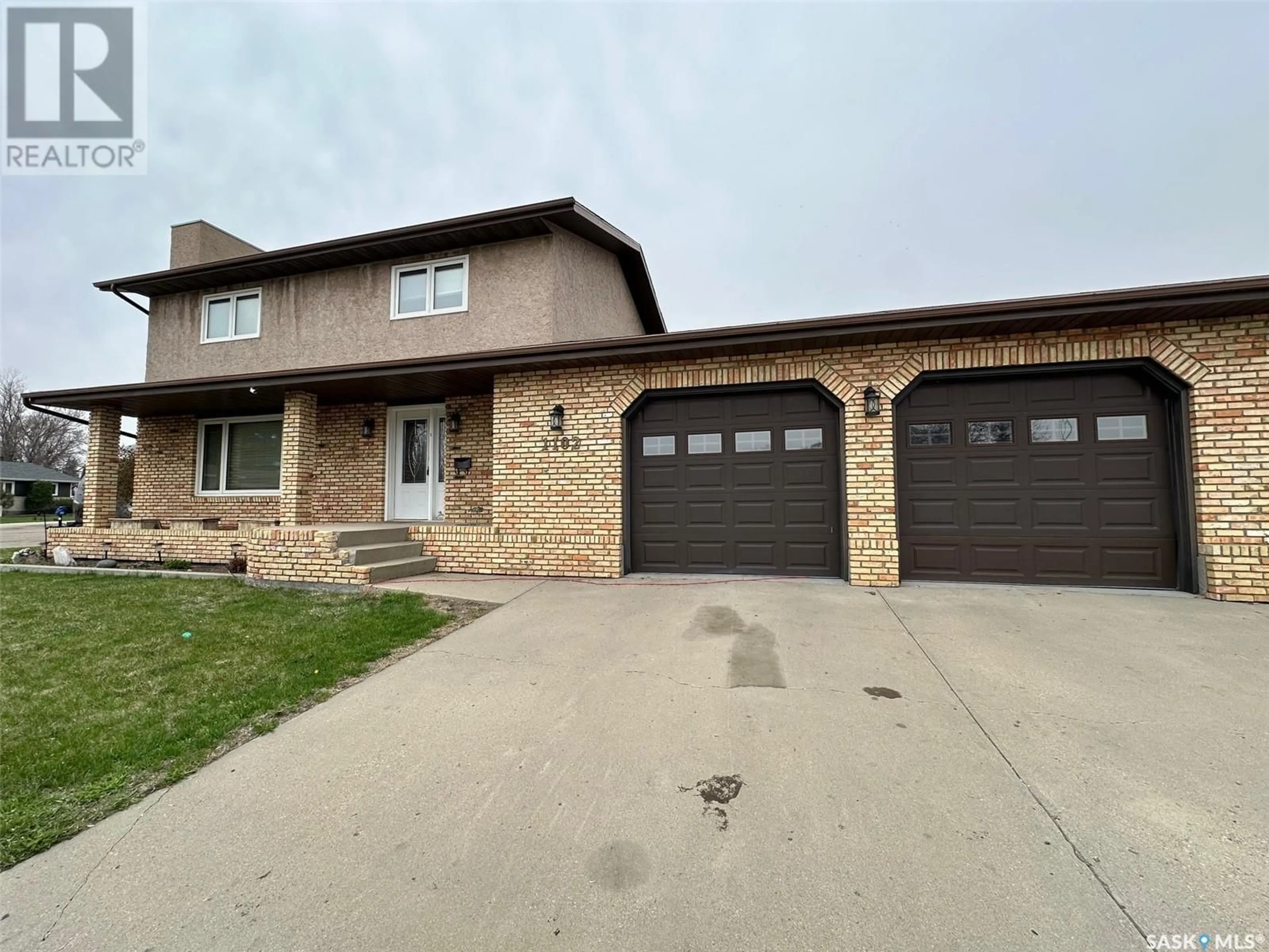 Home with brick exterior material, street for 1102 SINCLAIR BAY, Estevan Saskatchewan S4A2M7