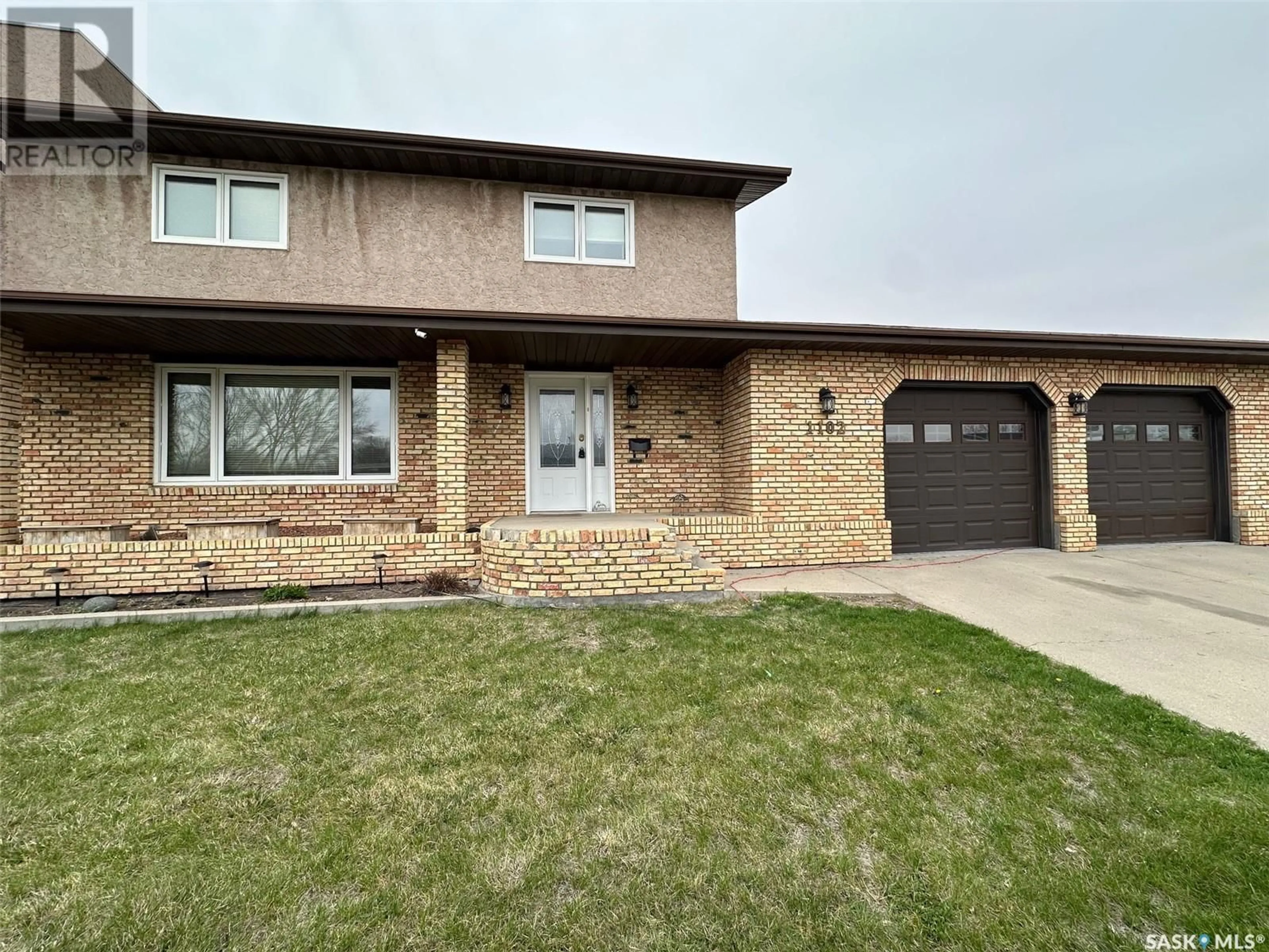 Home with brick exterior material, street for 1102 SINCLAIR BAY, Estevan Saskatchewan S4A2M7