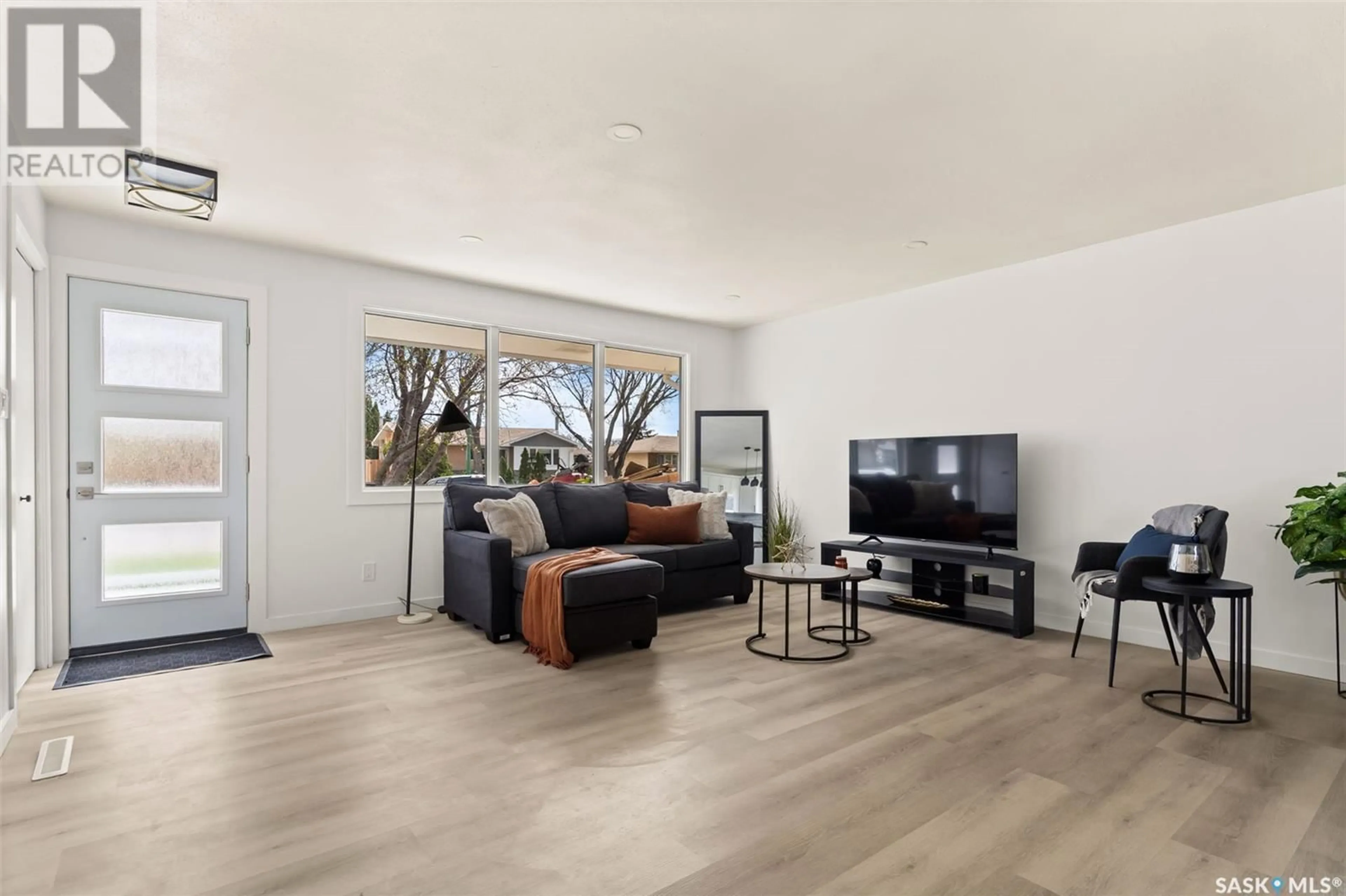 Living room with furniture, wood/laminate floor for 1612 8TH AVENUE, Regina Saskatchewan S4R0G3