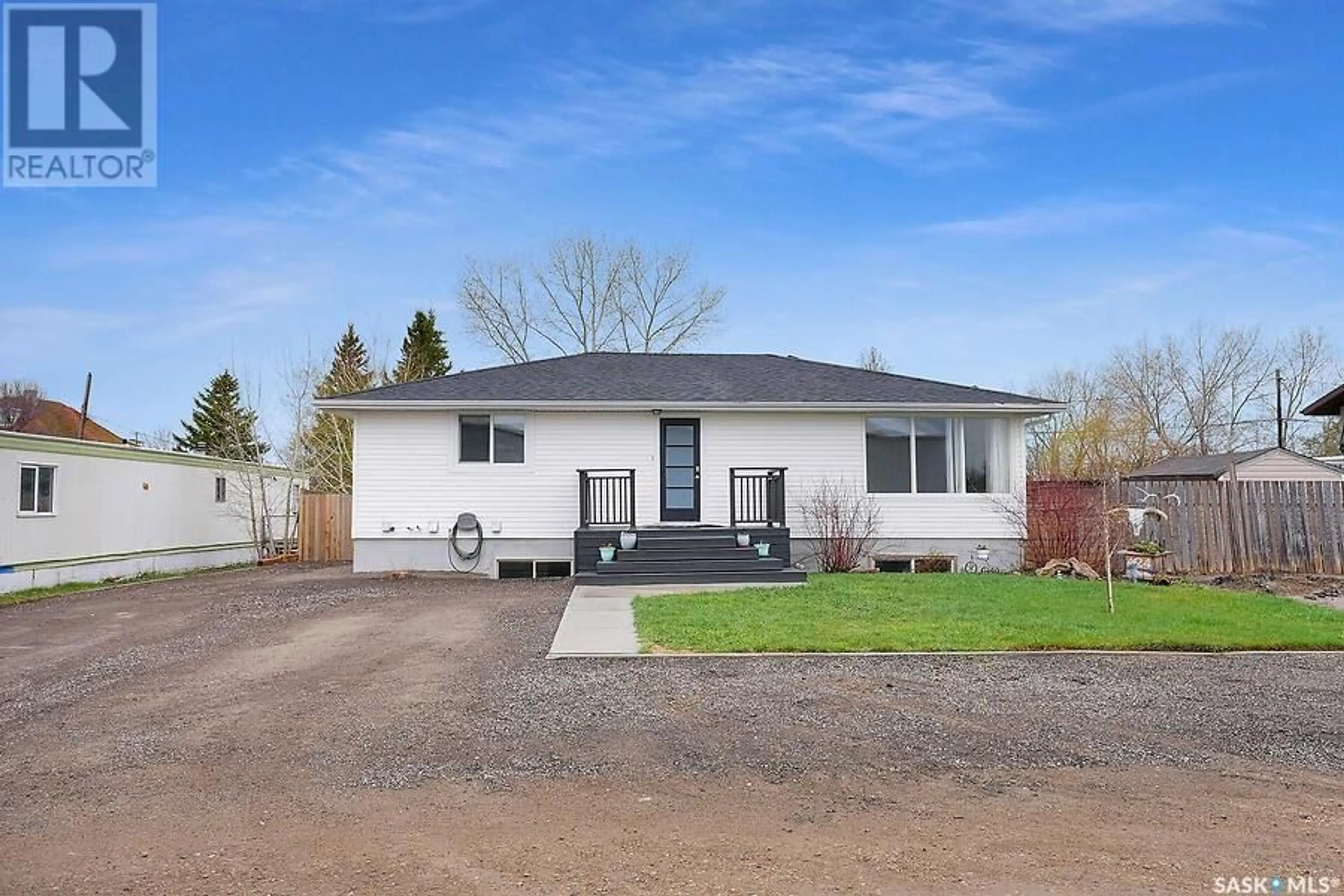 Home with vinyl exterior material, street for 424 BRUNSWICK STREET, Pense Saskatchewan S0G3W0