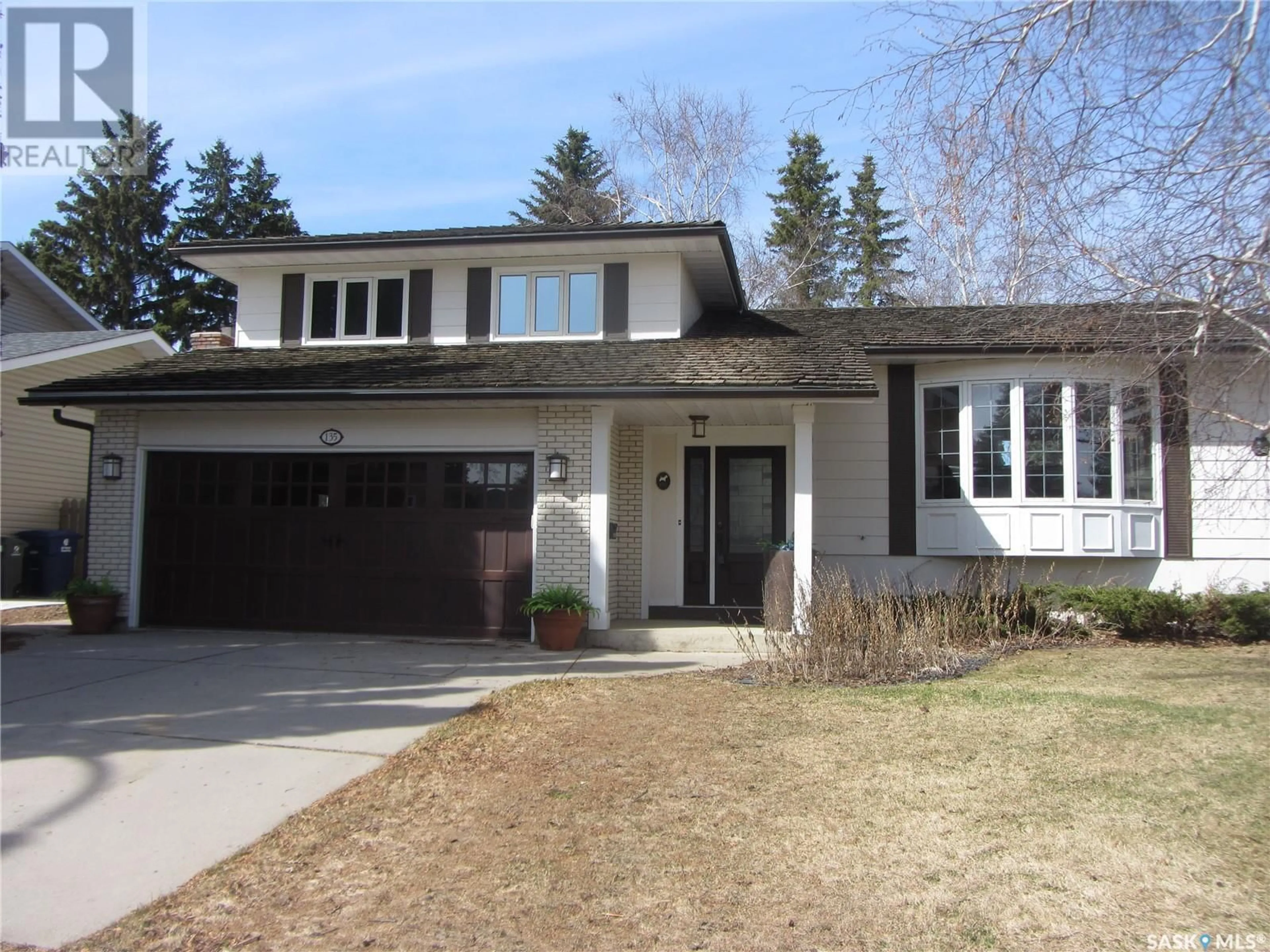 Home with vinyl exterior material, street for 135 SKEENA CRESCENT, Saskatoon Saskatchewan S7K4G6