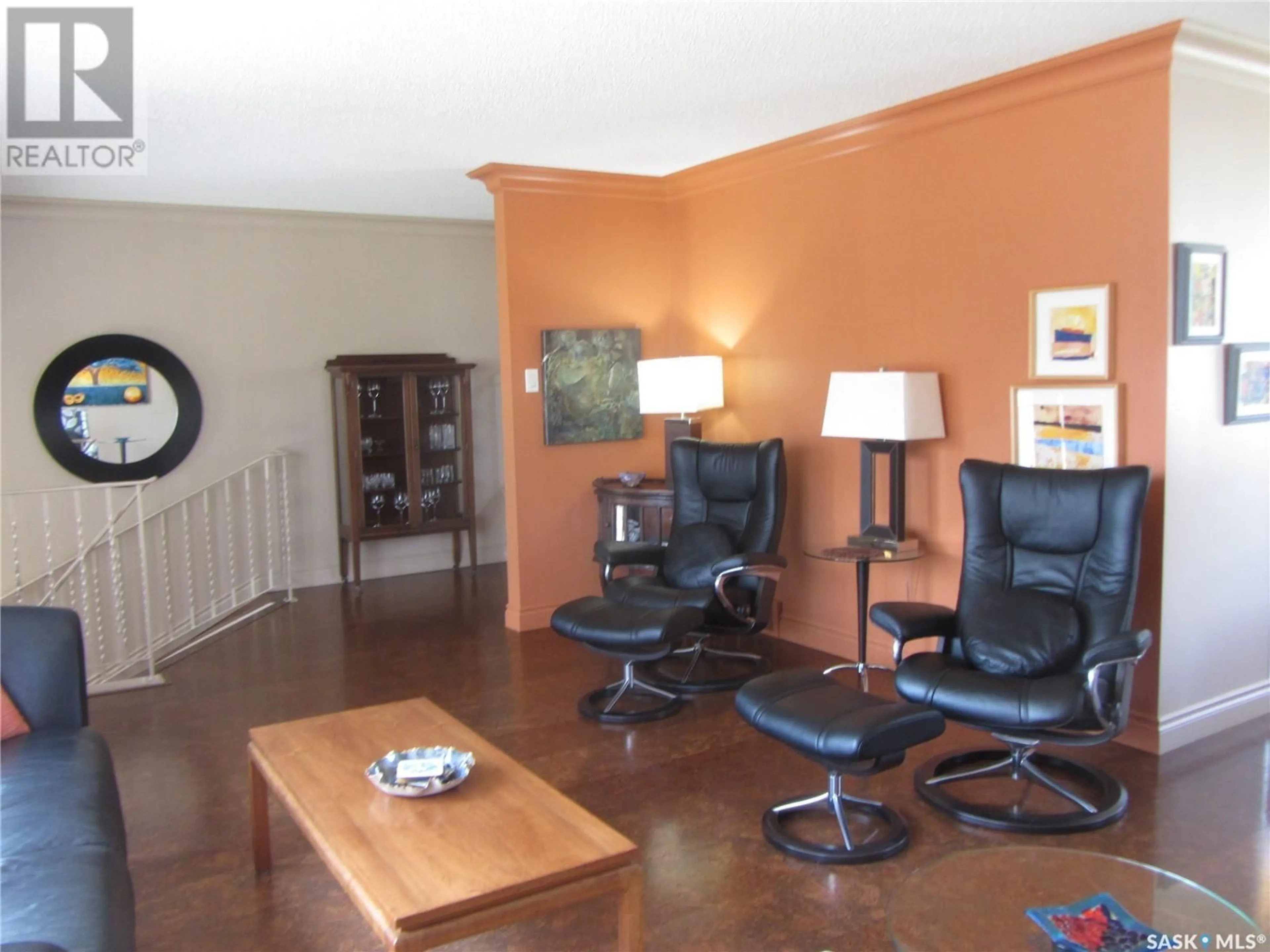 Living room with furniture, wood/laminate floor for 135 SKEENA CRESCENT, Saskatoon Saskatchewan S7K4G6