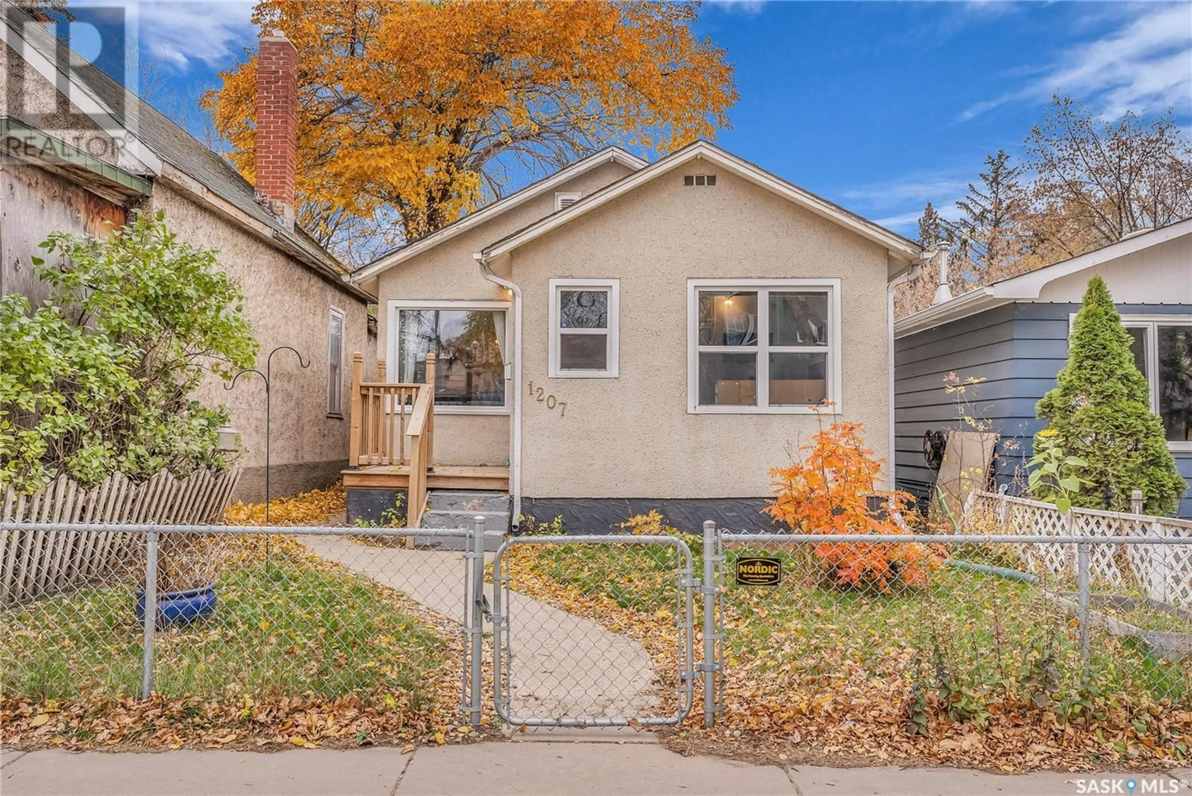 Home with vinyl exterior material, street for 1207 D AVENUE, Saskatoon Saskatchewan S7L1N9