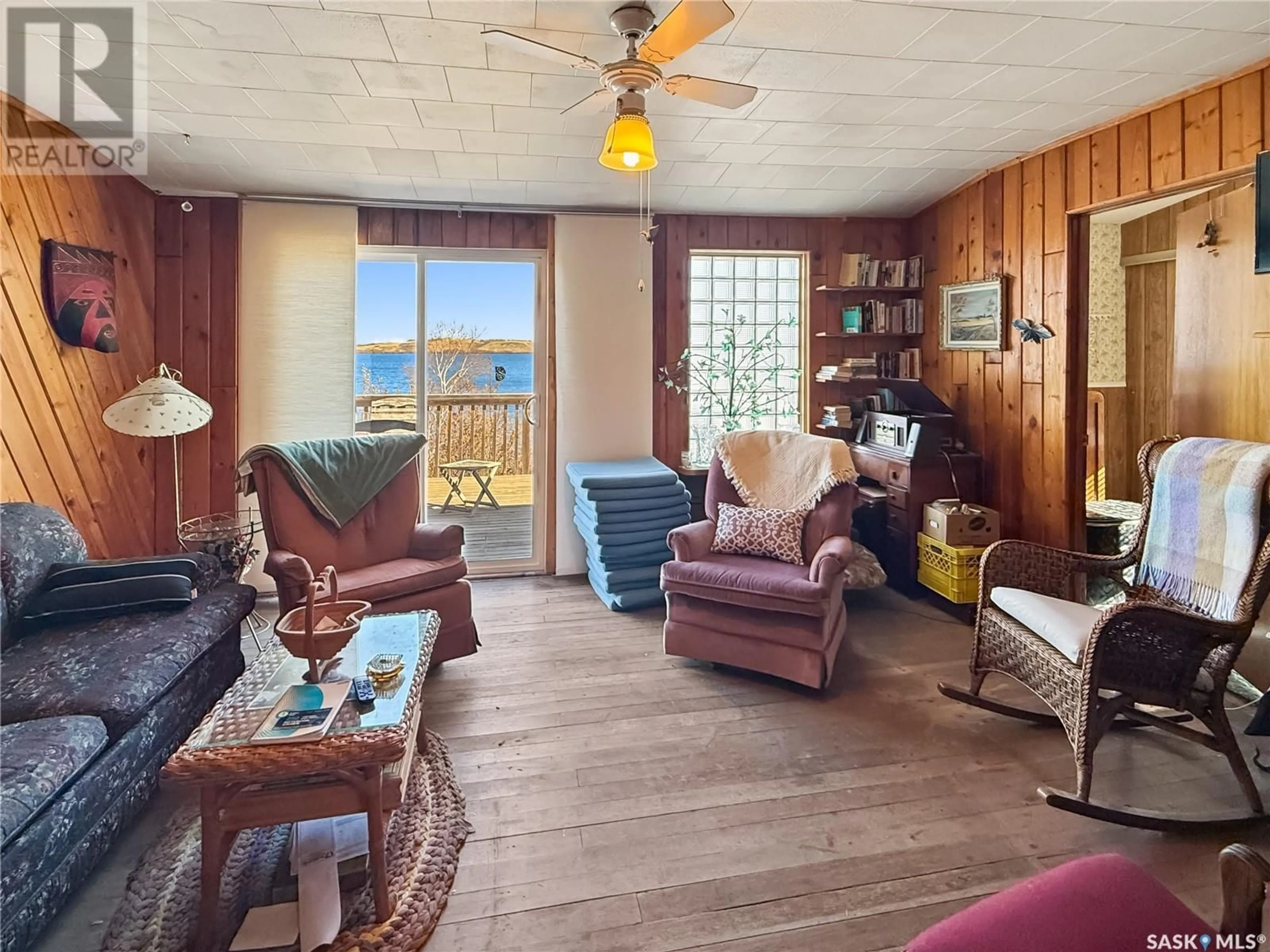 Living room with furniture, wood/laminate floor for 25 ELDRIDGE DRIVE, Lanz Point Saskatchewan S0M0L0