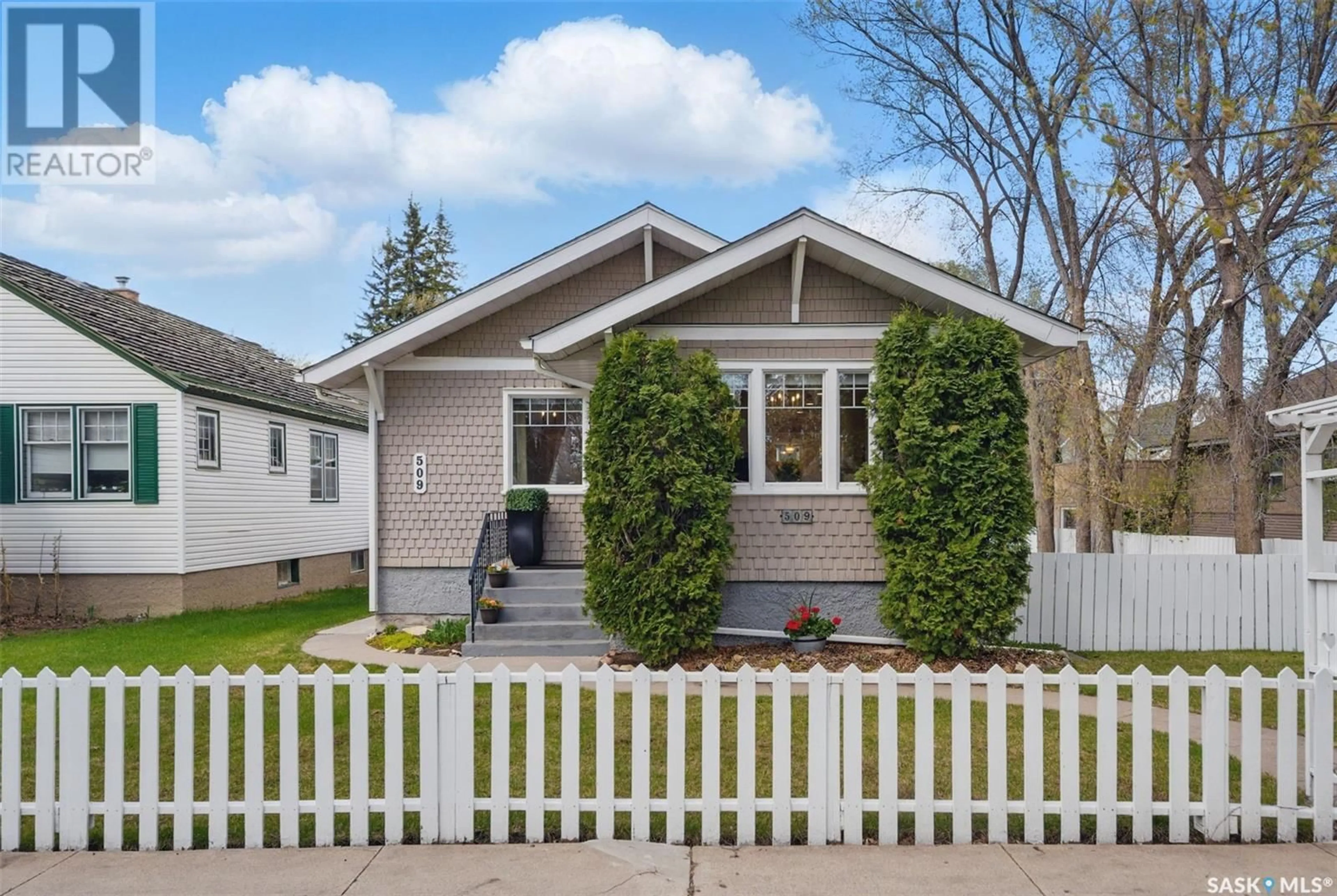 Home with vinyl exterior material, street for 509 7TH STREET, Saskatoon Saskatchewan S7H0X6