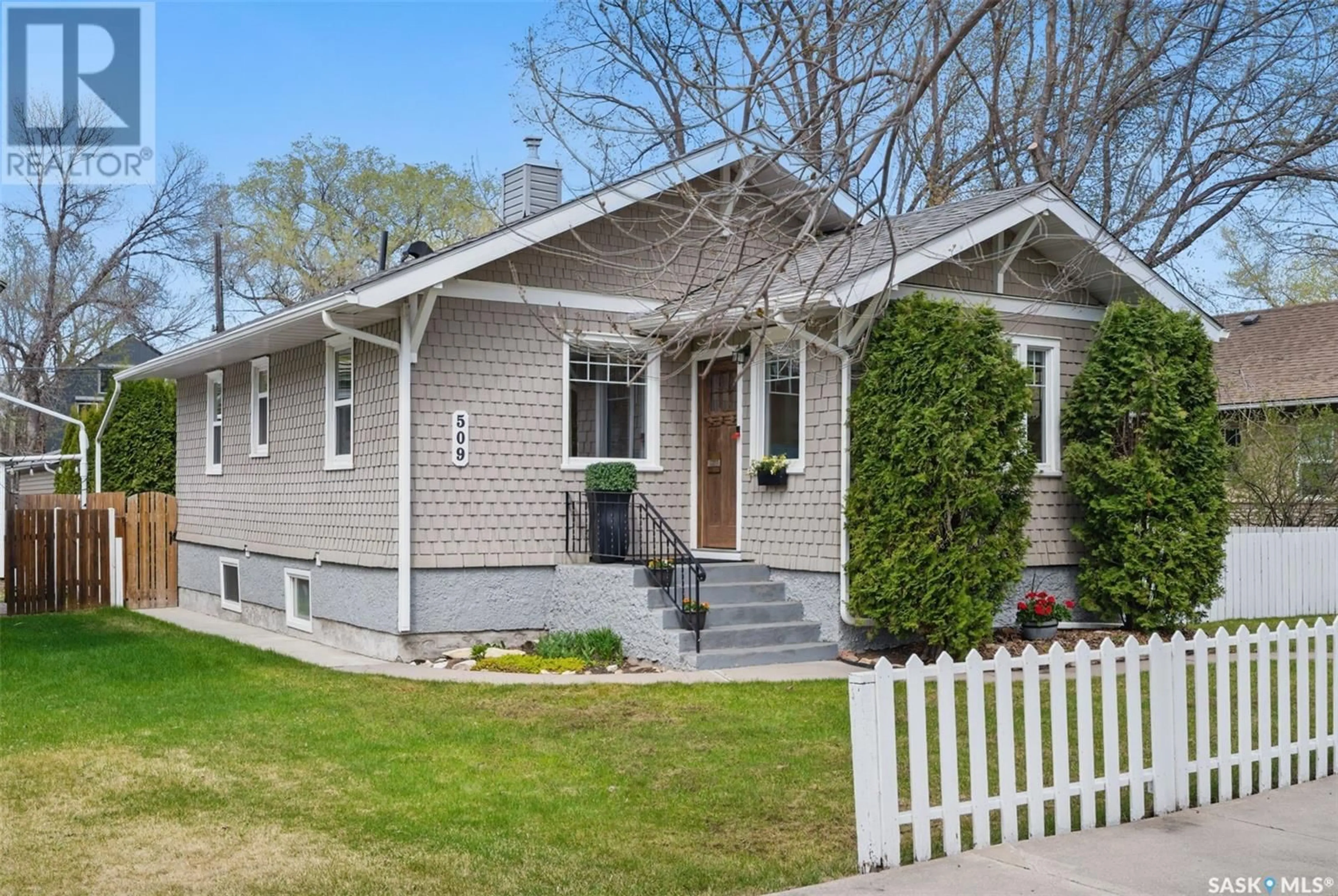 Home with vinyl exterior material, street for 509 7TH STREET, Saskatoon Saskatchewan S7H0X6