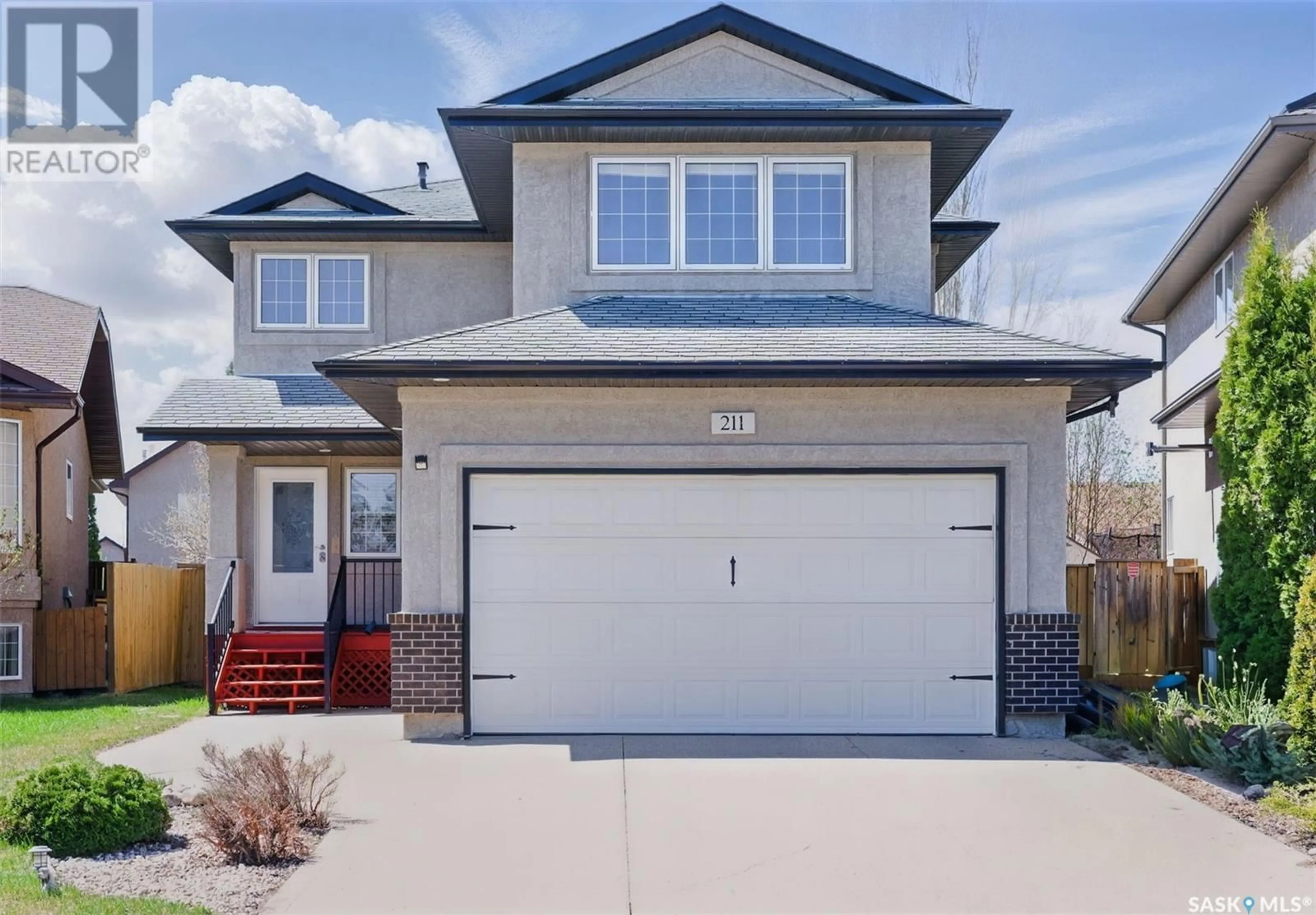 Home with vinyl exterior material, street for 211 BECKETT GREEN, Saskatoon Saskatchewan S7N4W6