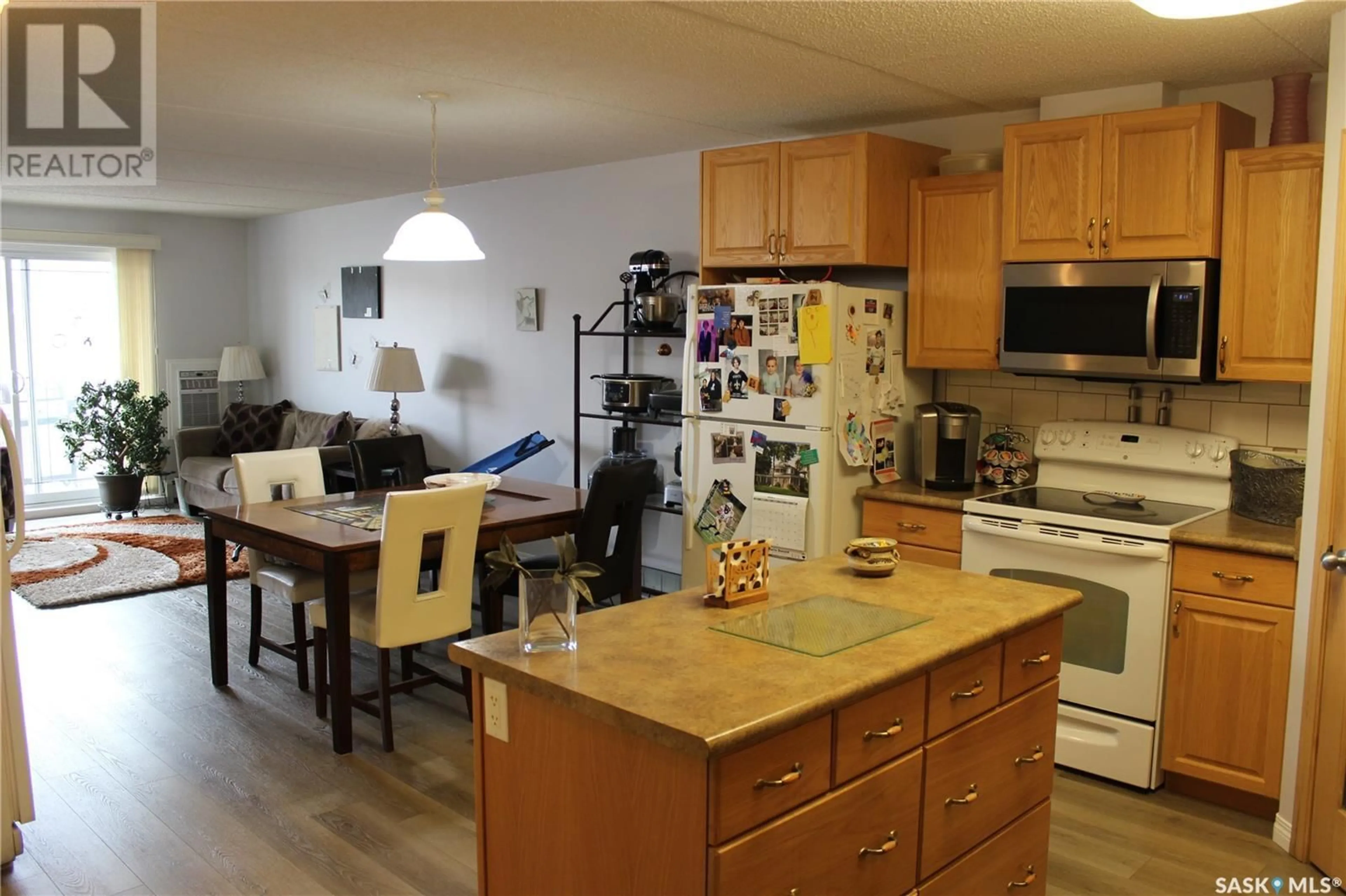 Open concept kitchen, wood/laminate floor for 206 - 1637 FIRST STREET, Estevan Saskatchewan S4A2X4