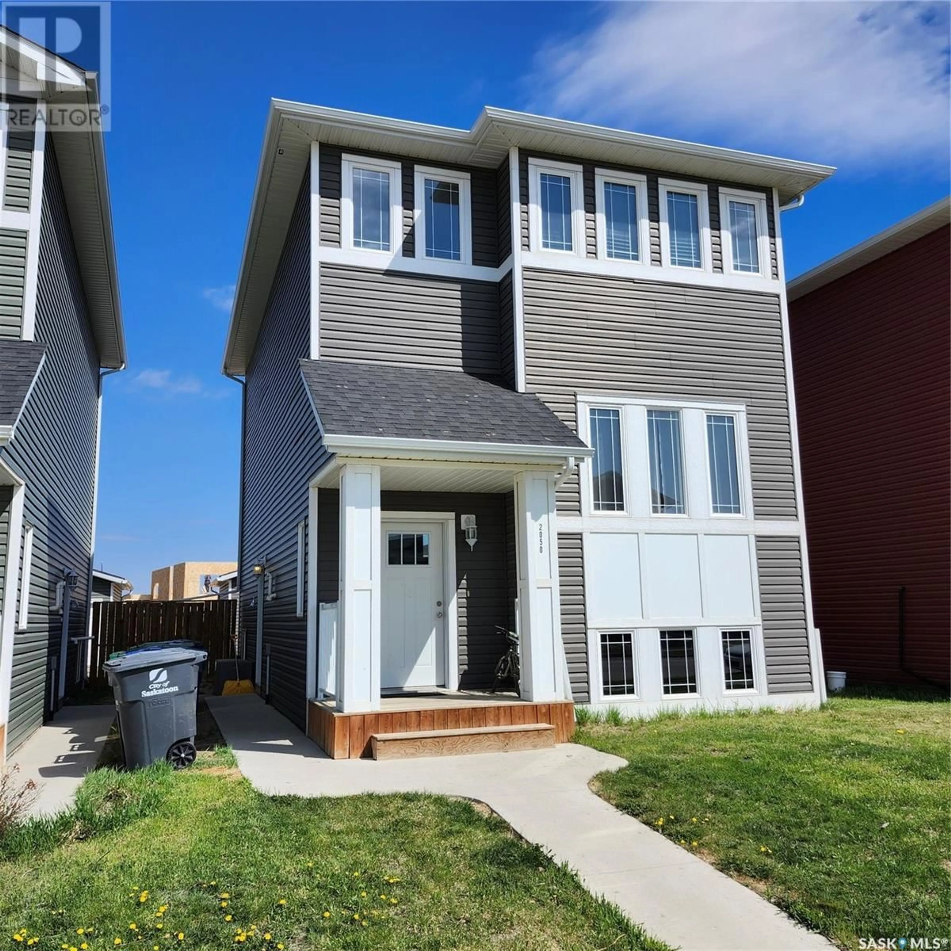 Home with vinyl exterior material, street for 2050 KENSINGTON ROAD, Saskatoon Saskatchewan S7L6P5