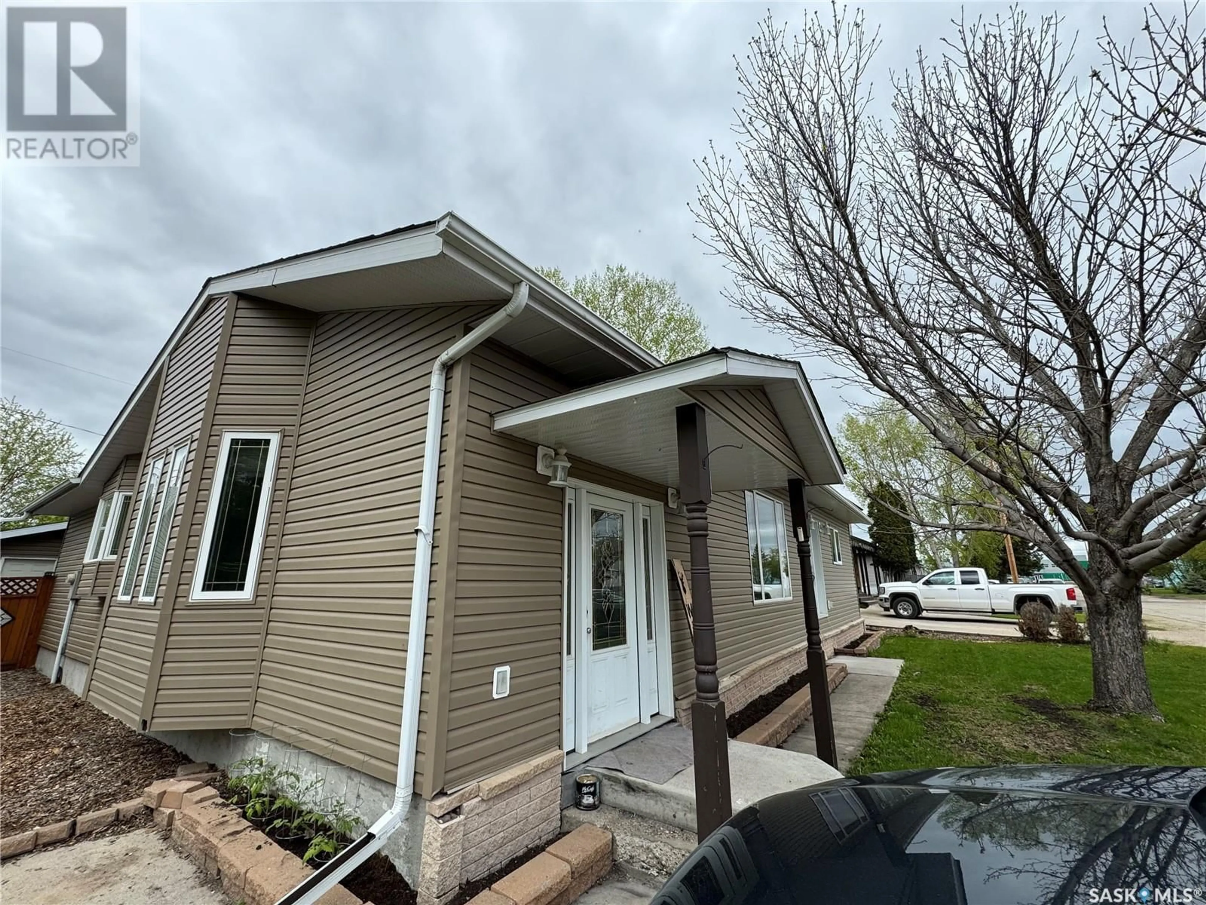 Home with vinyl exterior material, street for 513 HUDSON STREET, Hudson Bay Saskatchewan S0E0Y0