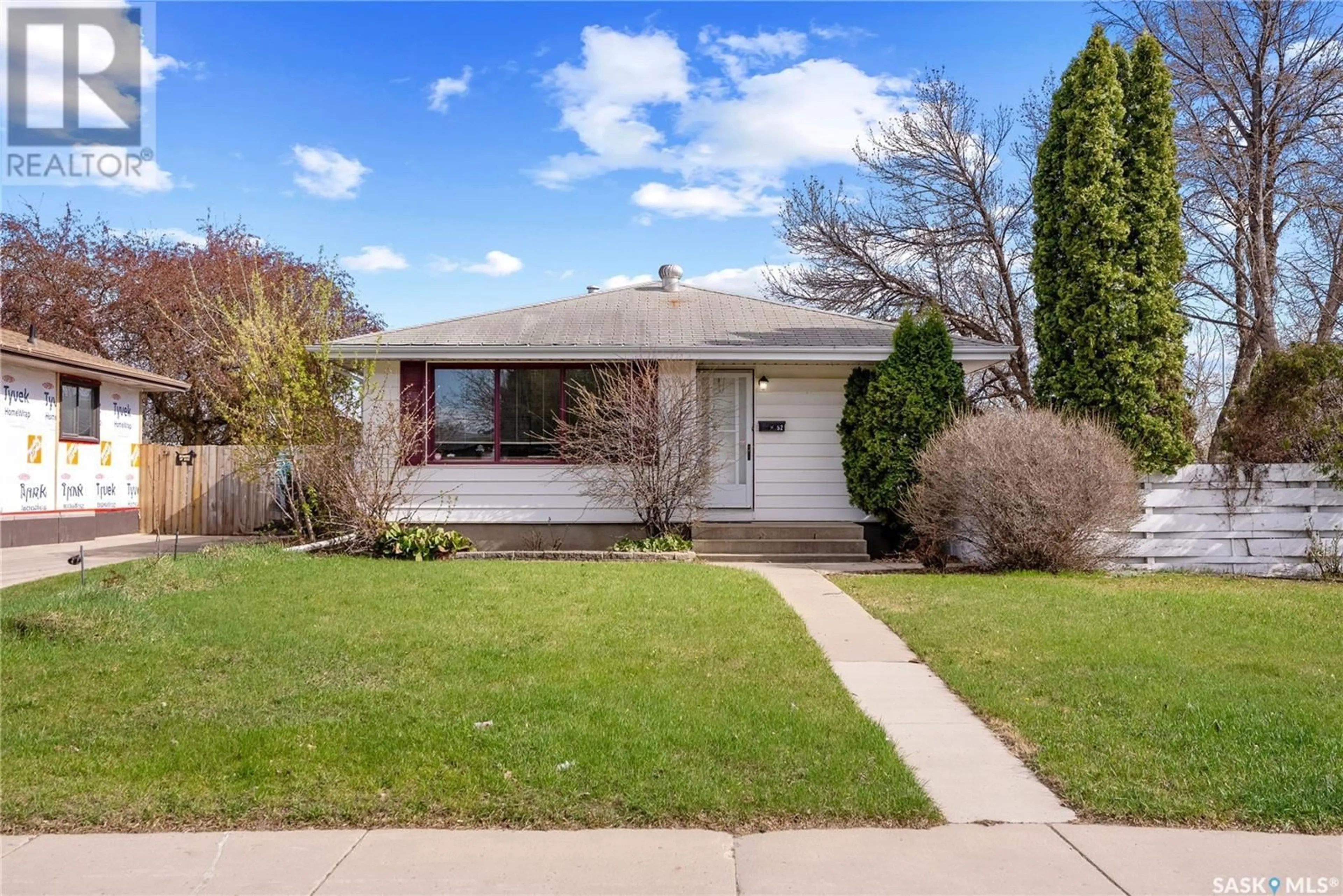 Home with vinyl exterior material, street for 52 MADISON CRESCENT, Saskatoon Saskatchewan S7L3V8