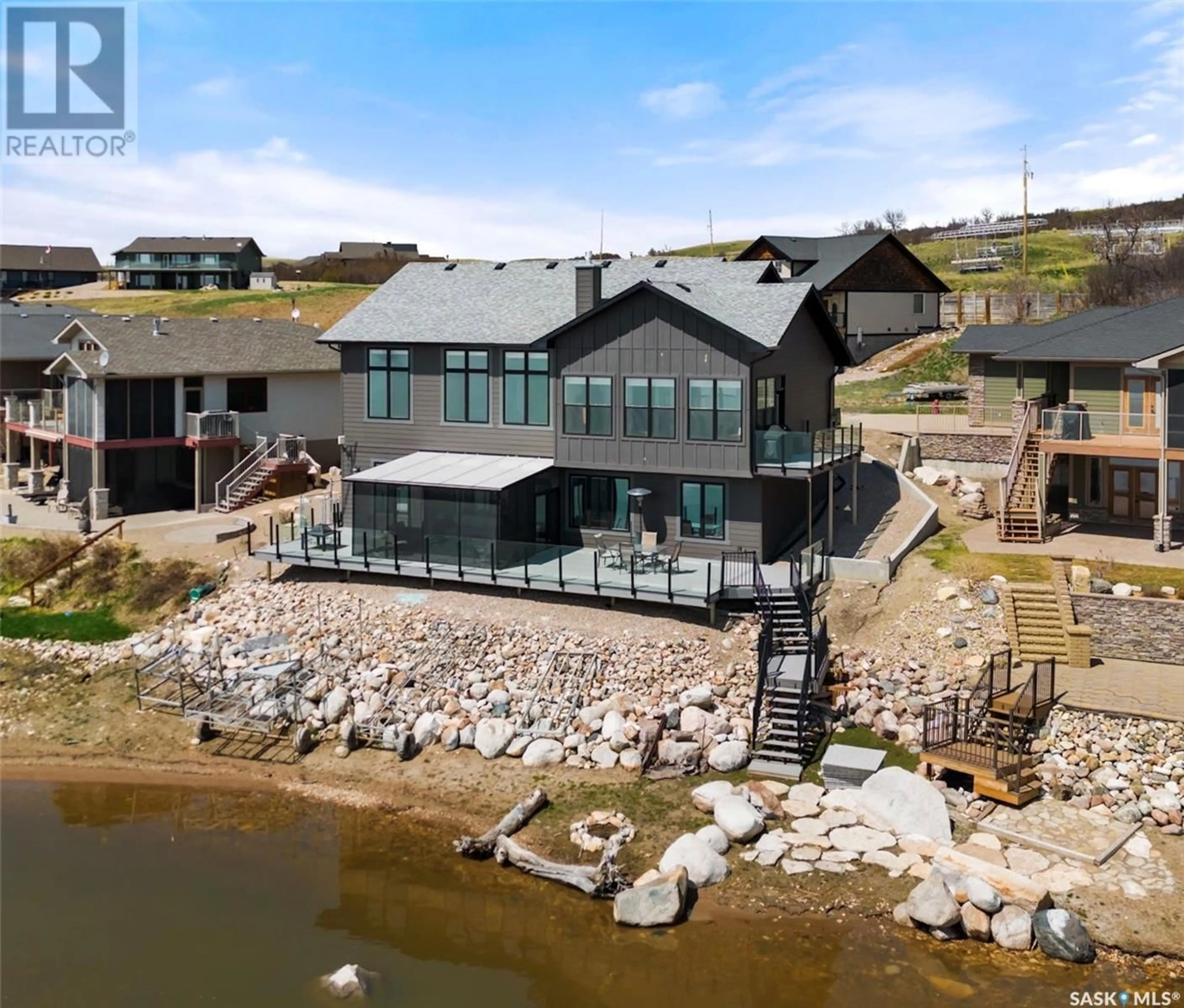 A pic from outside/outdoor area/front of a property/back of a property/a pic from drone, water/lake/river/ocean view for 332 MIHR BAY, Sun Dale Saskatchewan S0G4L0