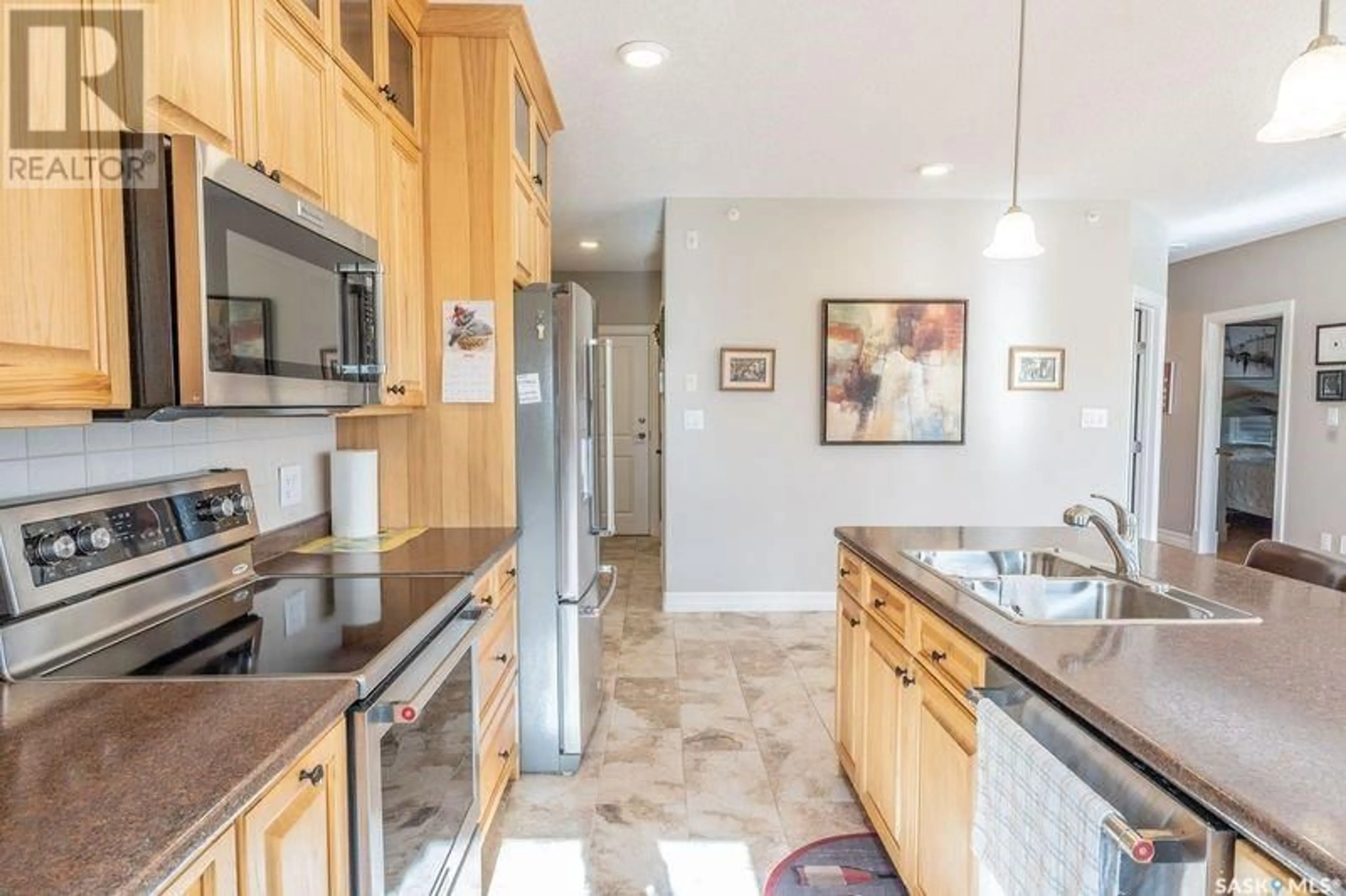 Open concept kitchen, ceramic/tile floor for #101 - 2800 LAKEVIEW DRIVE, Prince Albert Saskatchewan S6W0A4