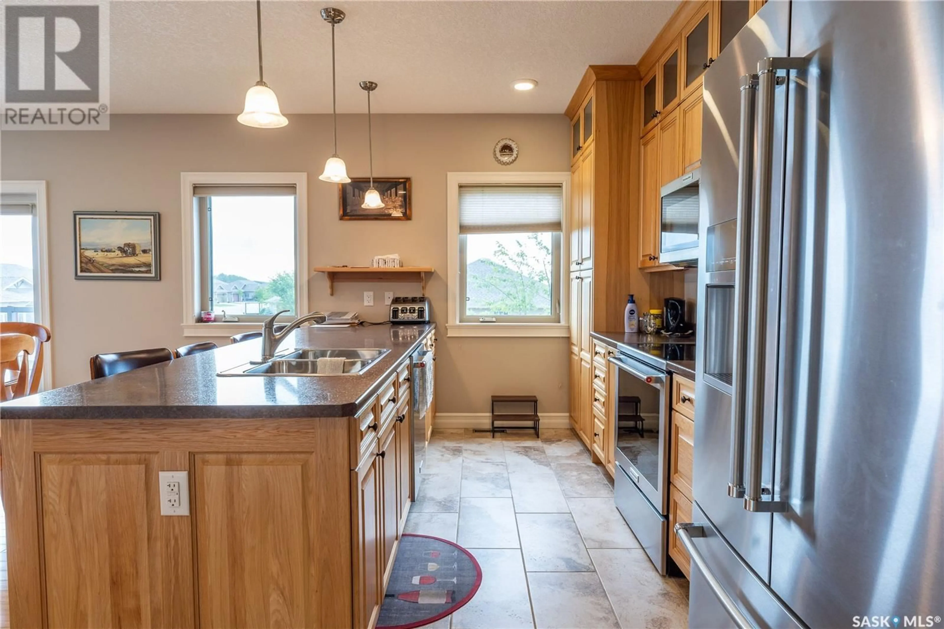 Open concept kitchen, ceramic/tile floor for #101 - 2800 LAKEVIEW DRIVE, Prince Albert Saskatchewan S6W0A4