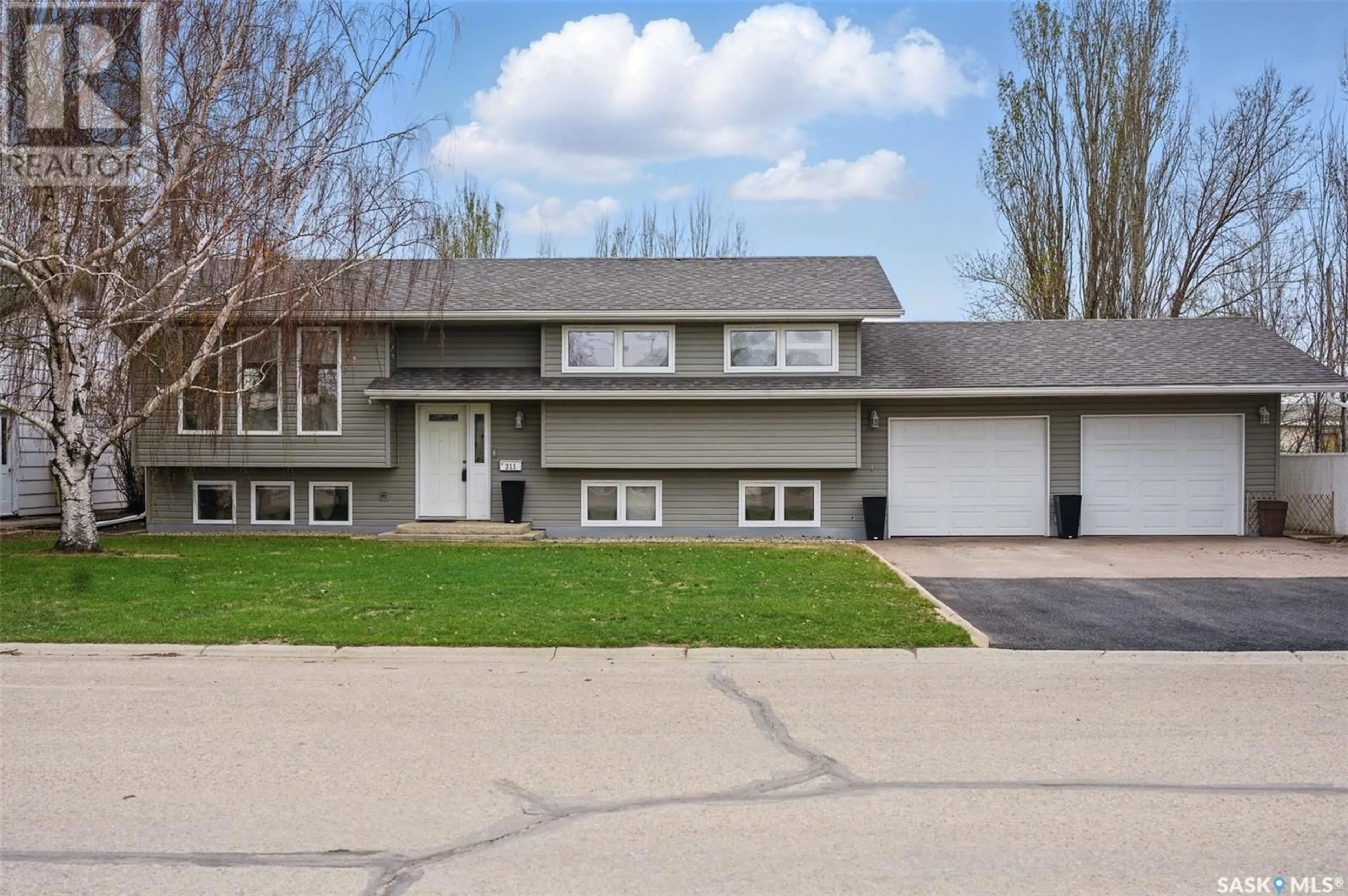 Home with vinyl exterior material, street for W - 311 2ND AVENUE, Watrous Saskatchewan S0K4T0
