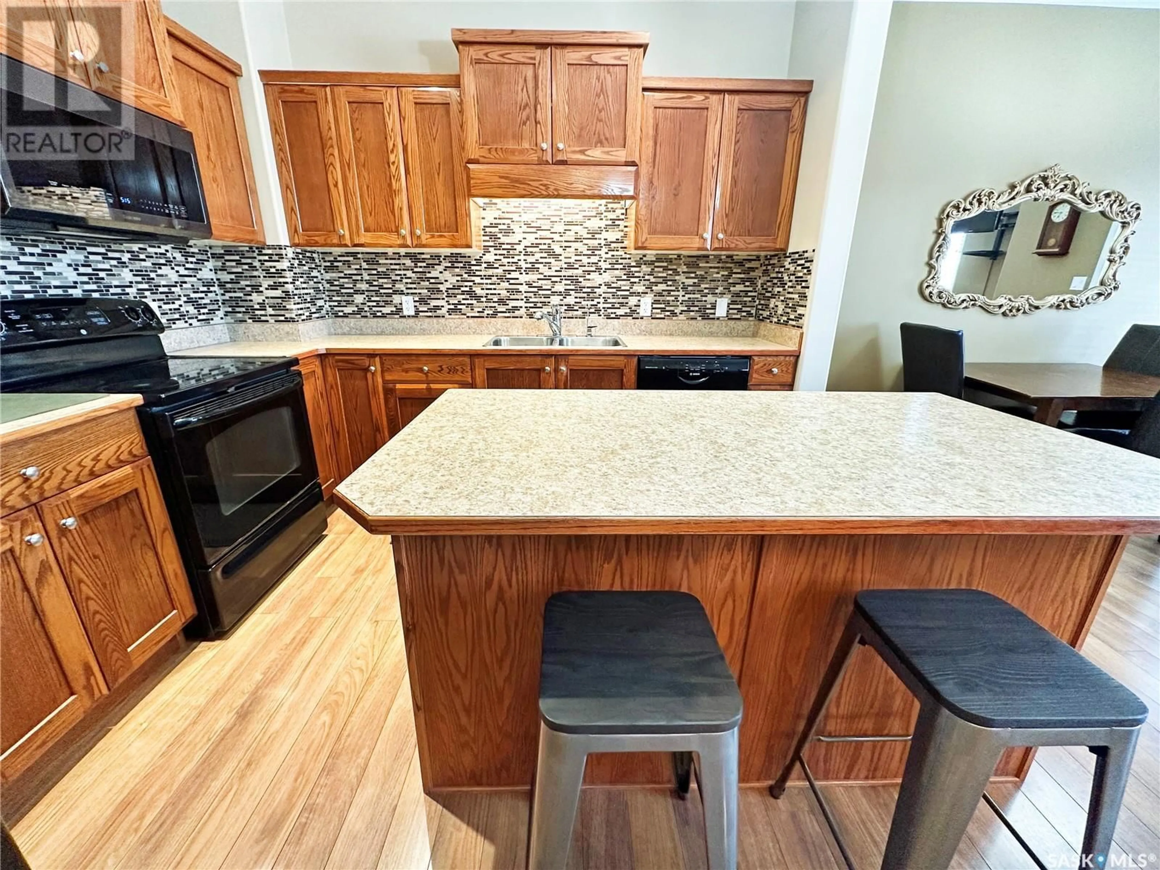 Open concept kitchen, unknown for E - 5701 MCINTOSH STREET, Swift Current Saskatchewan S9H1H7