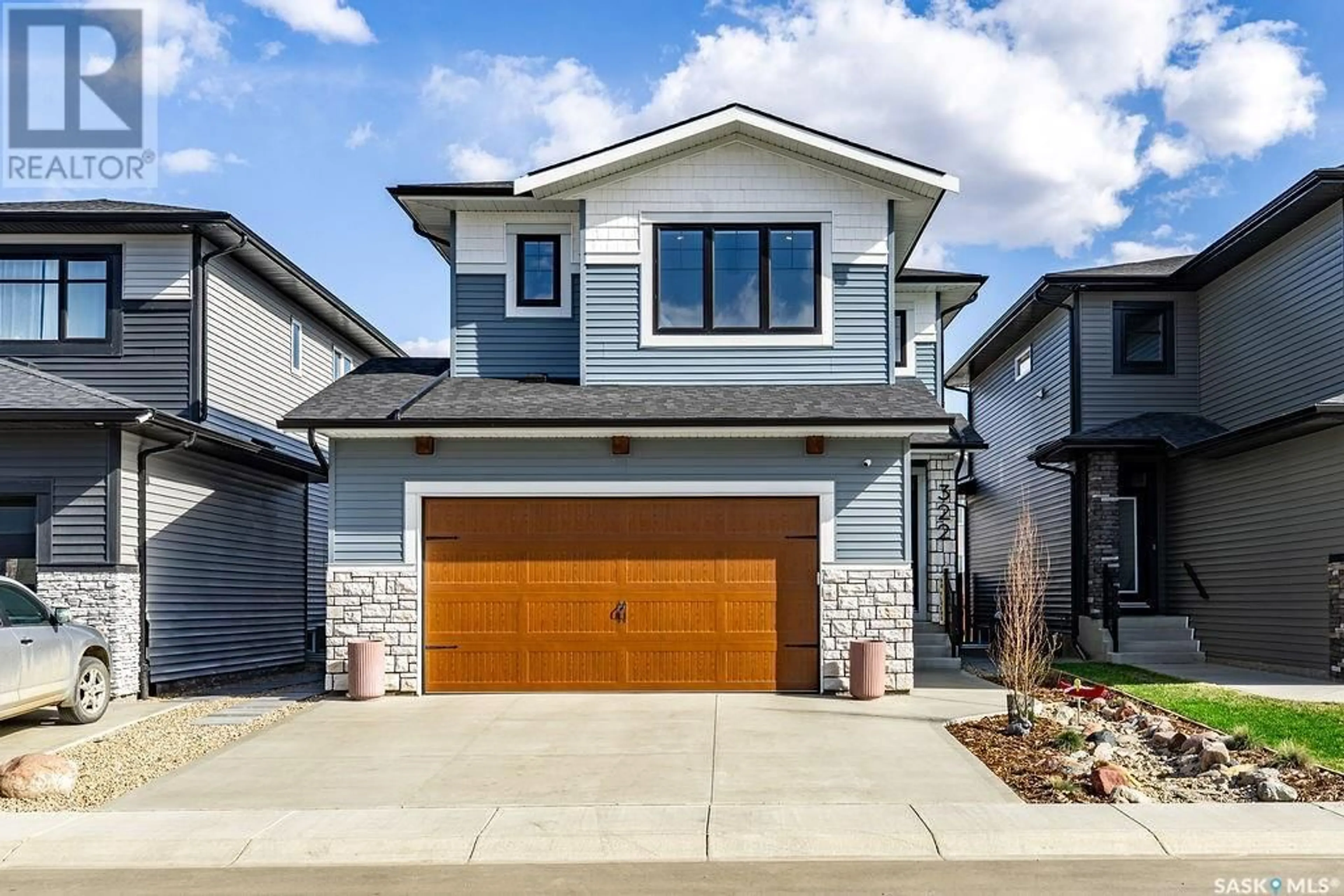 Home with brick exterior material, street for 322 ANISKOTAW BEND, Saskatoon Saskatchewan S7V1L9