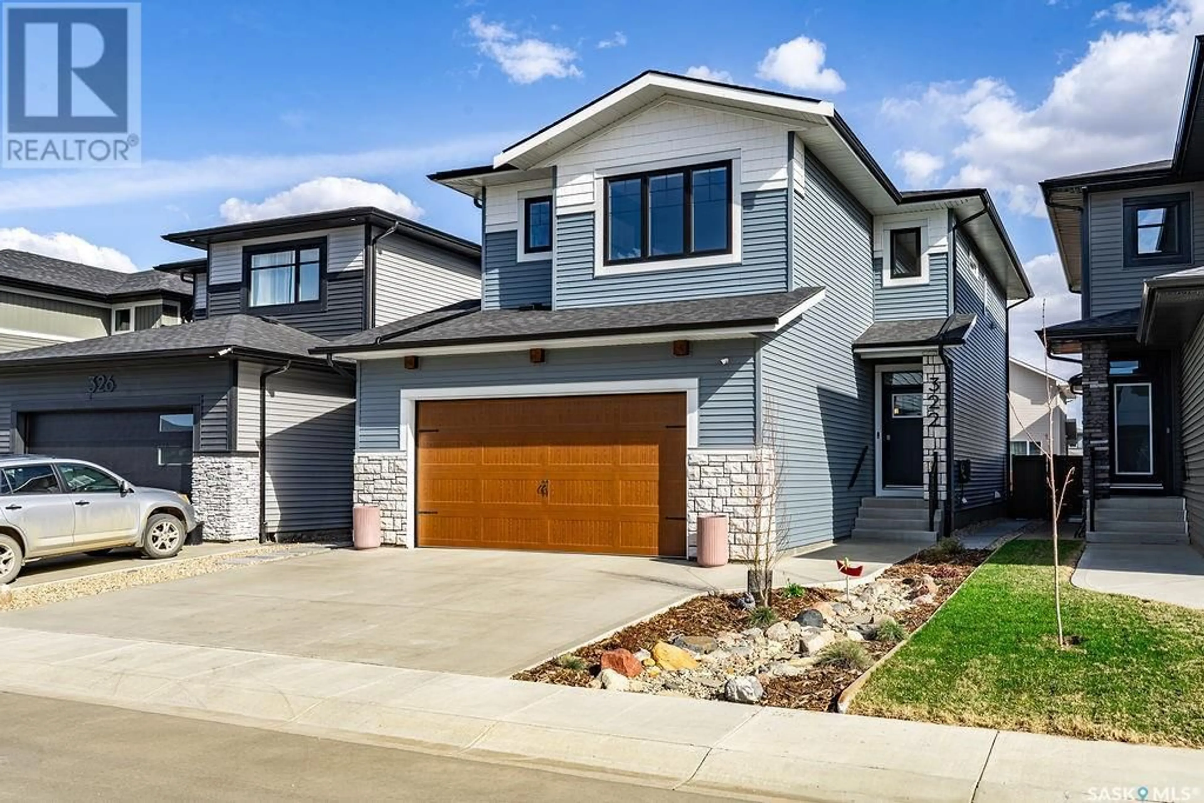 Home with brick exterior material, street for 322 ANISKOTAW BEND, Saskatoon Saskatchewan S7V1L9