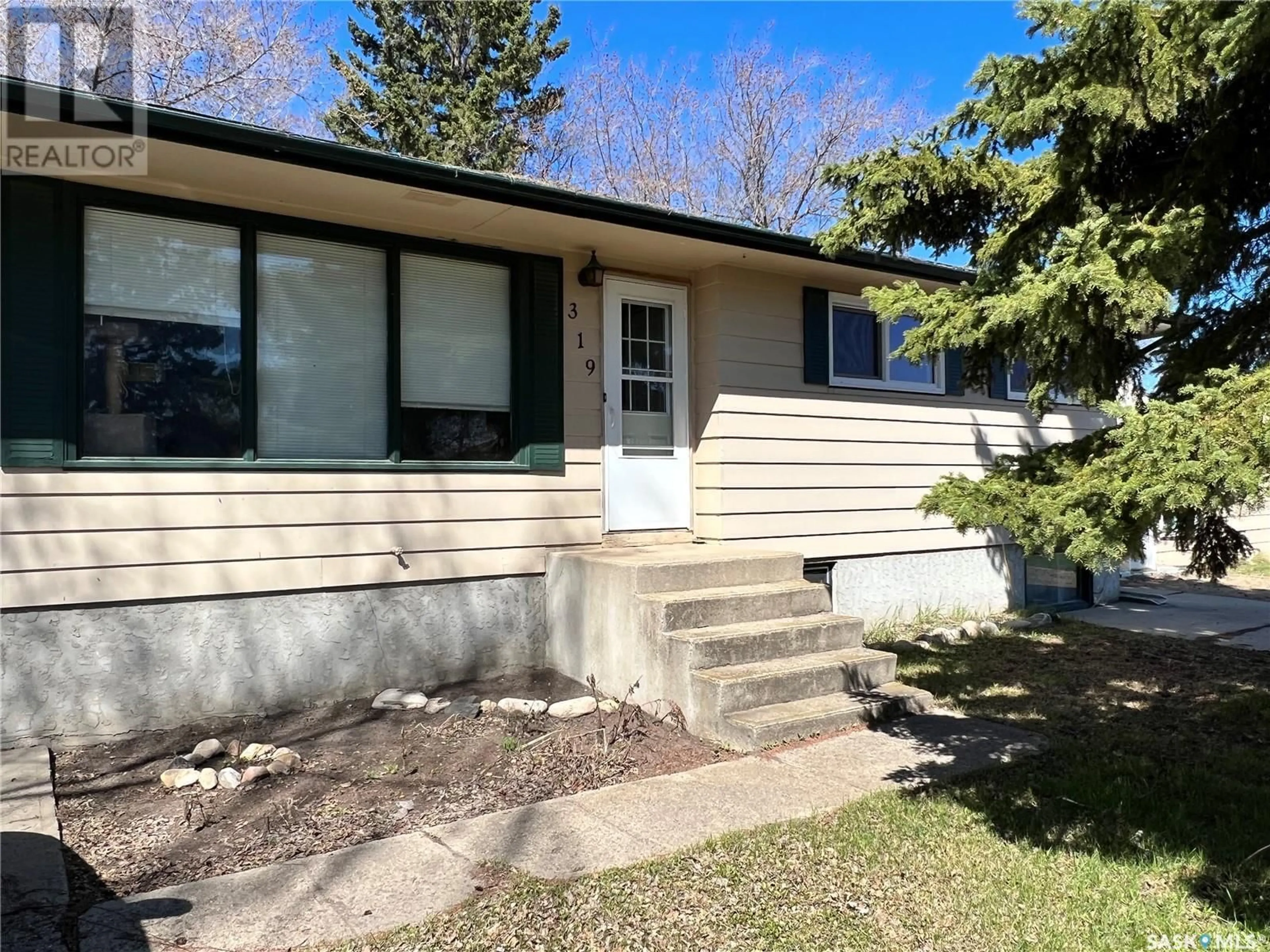 Home with vinyl exterior material, street for 319 10TH STREET, Humboldt Saskatchewan S0K2A0