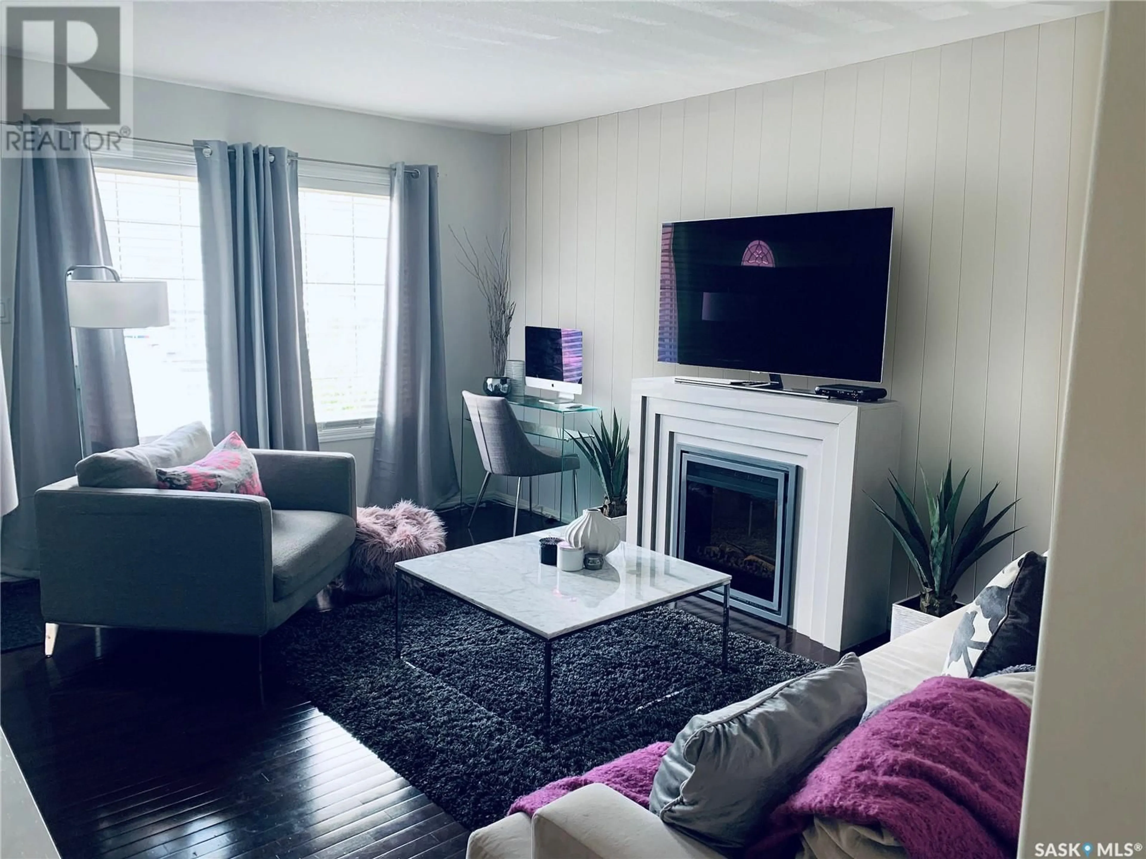 Living room with furniture, wood/laminate floor for 152 - 4801 CHILD AVENUE, Regina Saskatchewan S4X0C4