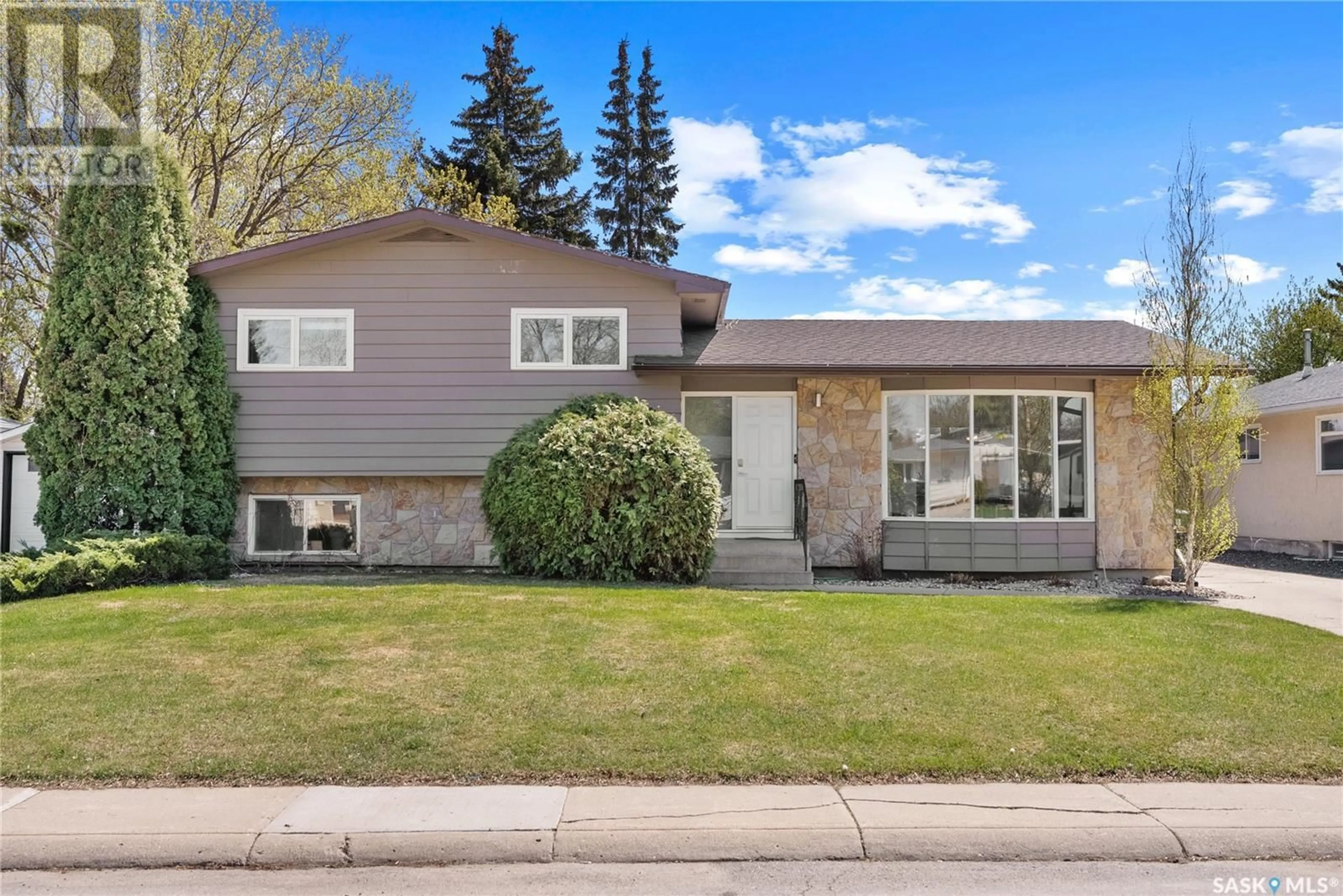 Home with vinyl exterior material, street for 77 ALBANY CRESCENT, Saskatoon Saskatchewan S7K1J4