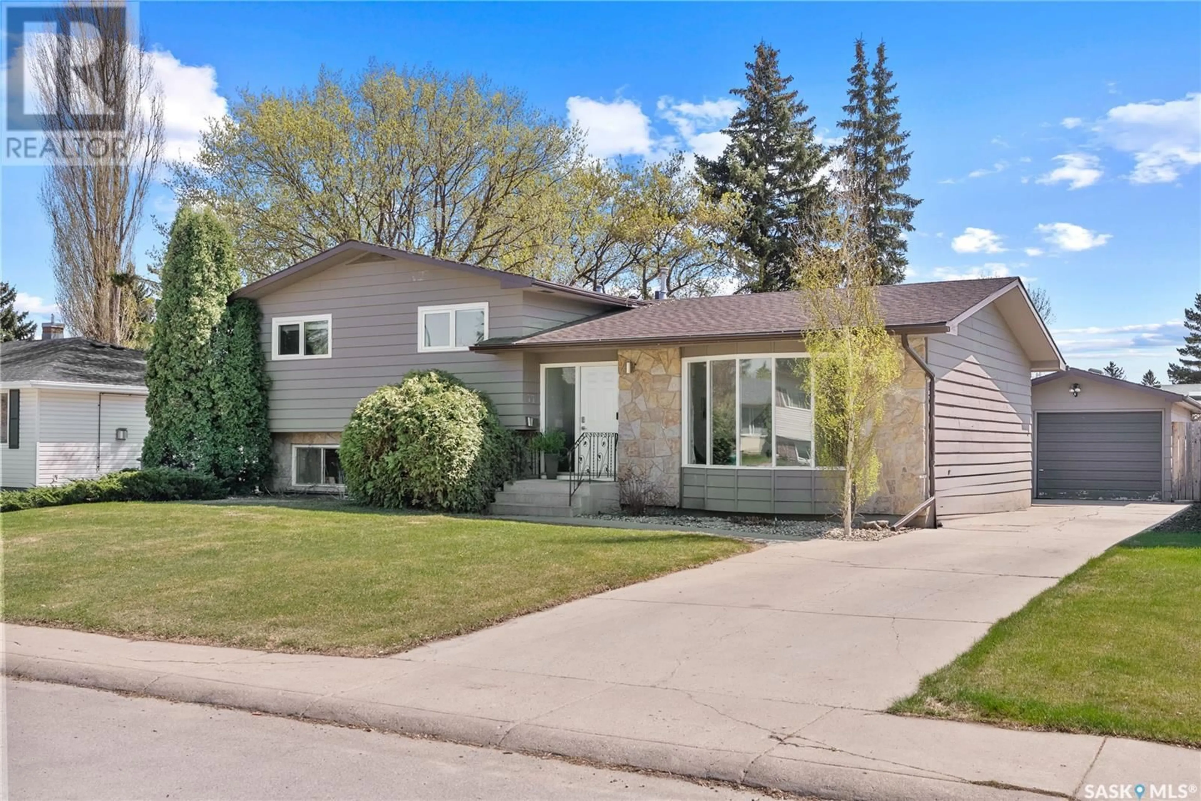 Home with vinyl exterior material, street for 77 ALBANY CRESCENT, Saskatoon Saskatchewan S7K1J4