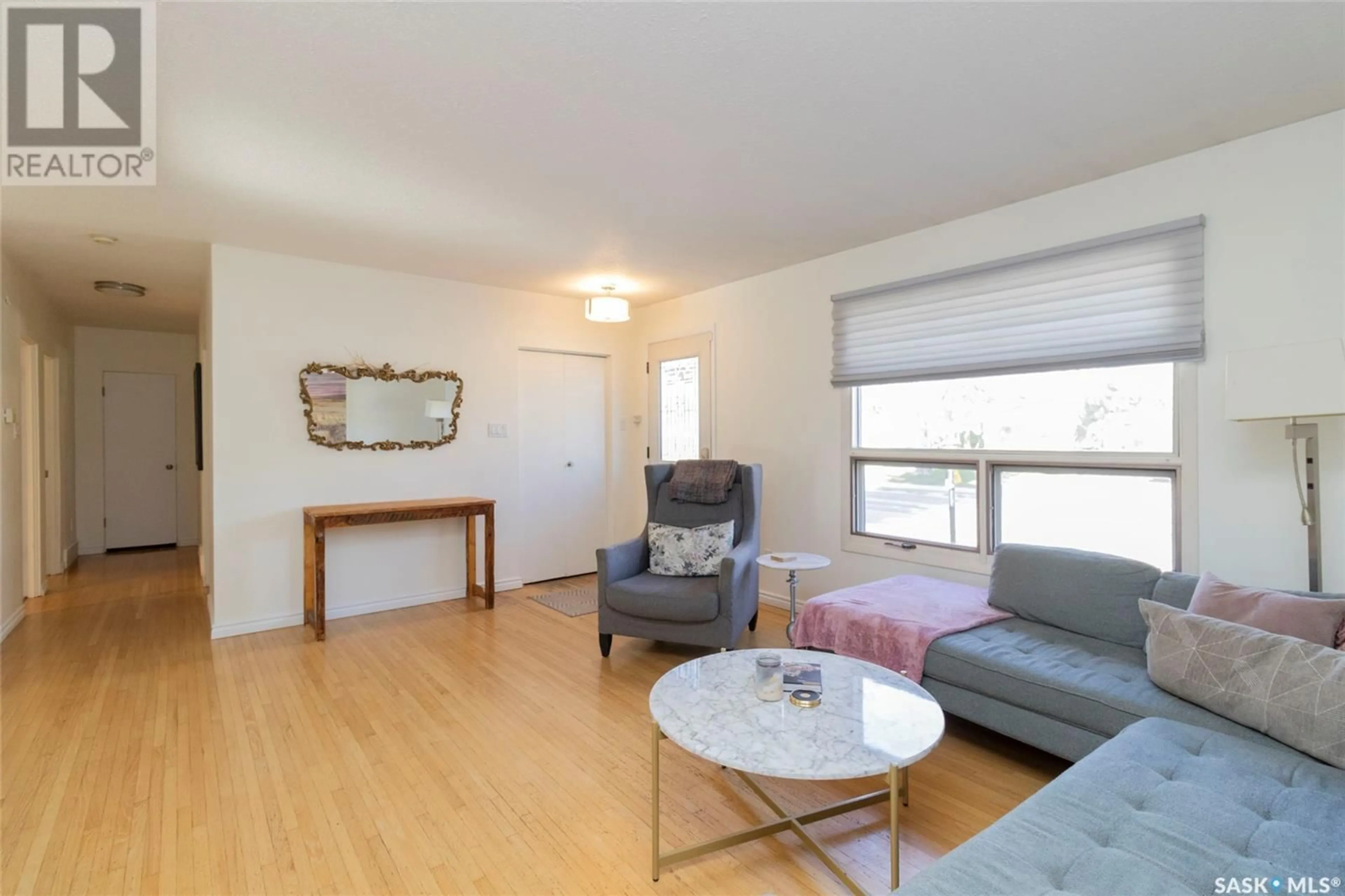 Living room with furniture, wood/laminate floor for 1606 GROSVENOR AVENUE, Saskatoon Saskatchewan S7H2T3
