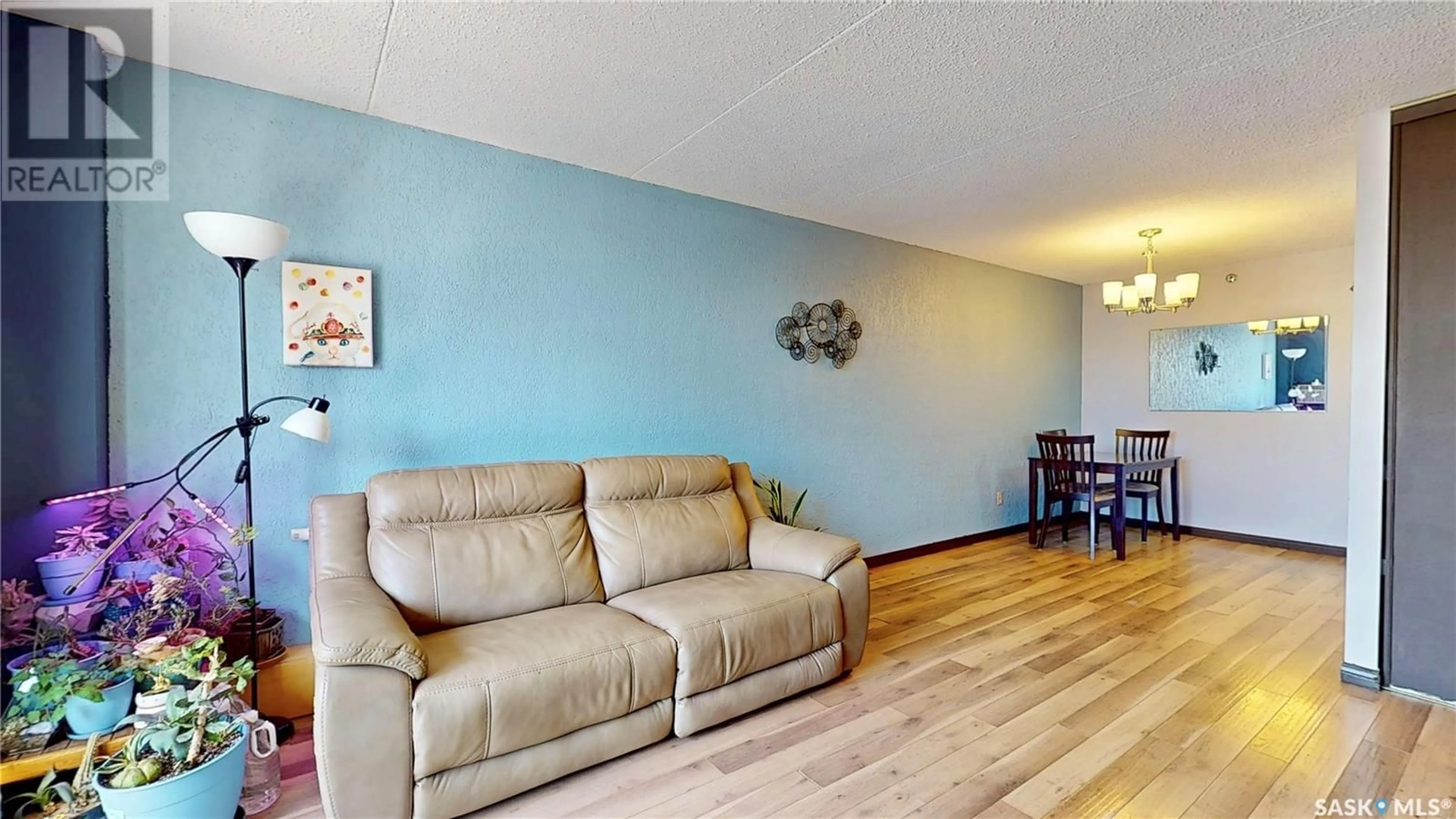 Living room with furniture, wood/laminate floor for 4045 - 310 RAE STREET, Regina Saskatchewan S4S6Y8