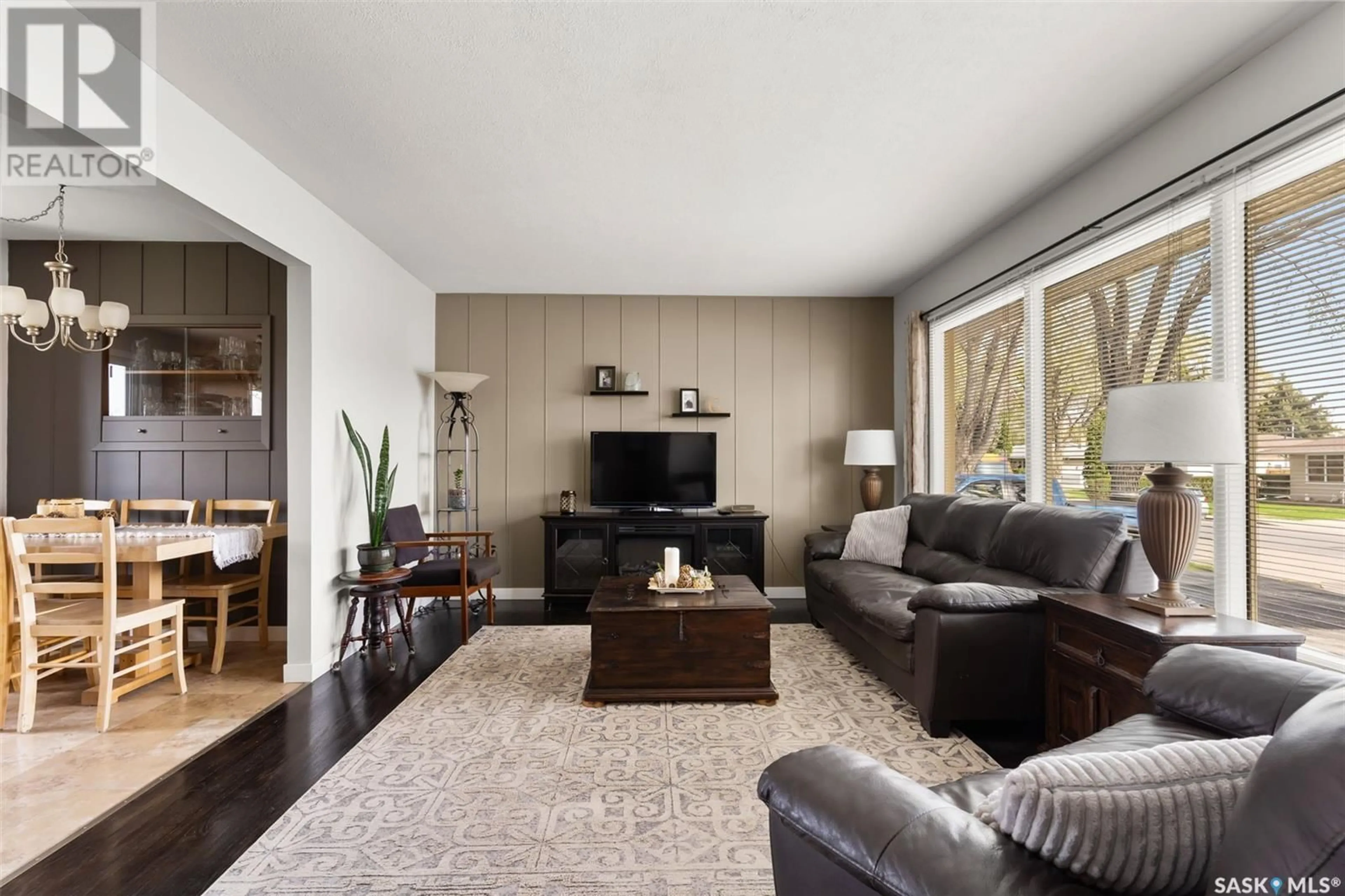 Living room with furniture, wood/laminate floor for 96 MCCAUL CRESCENT, Regina Saskatchewan S4R3X1