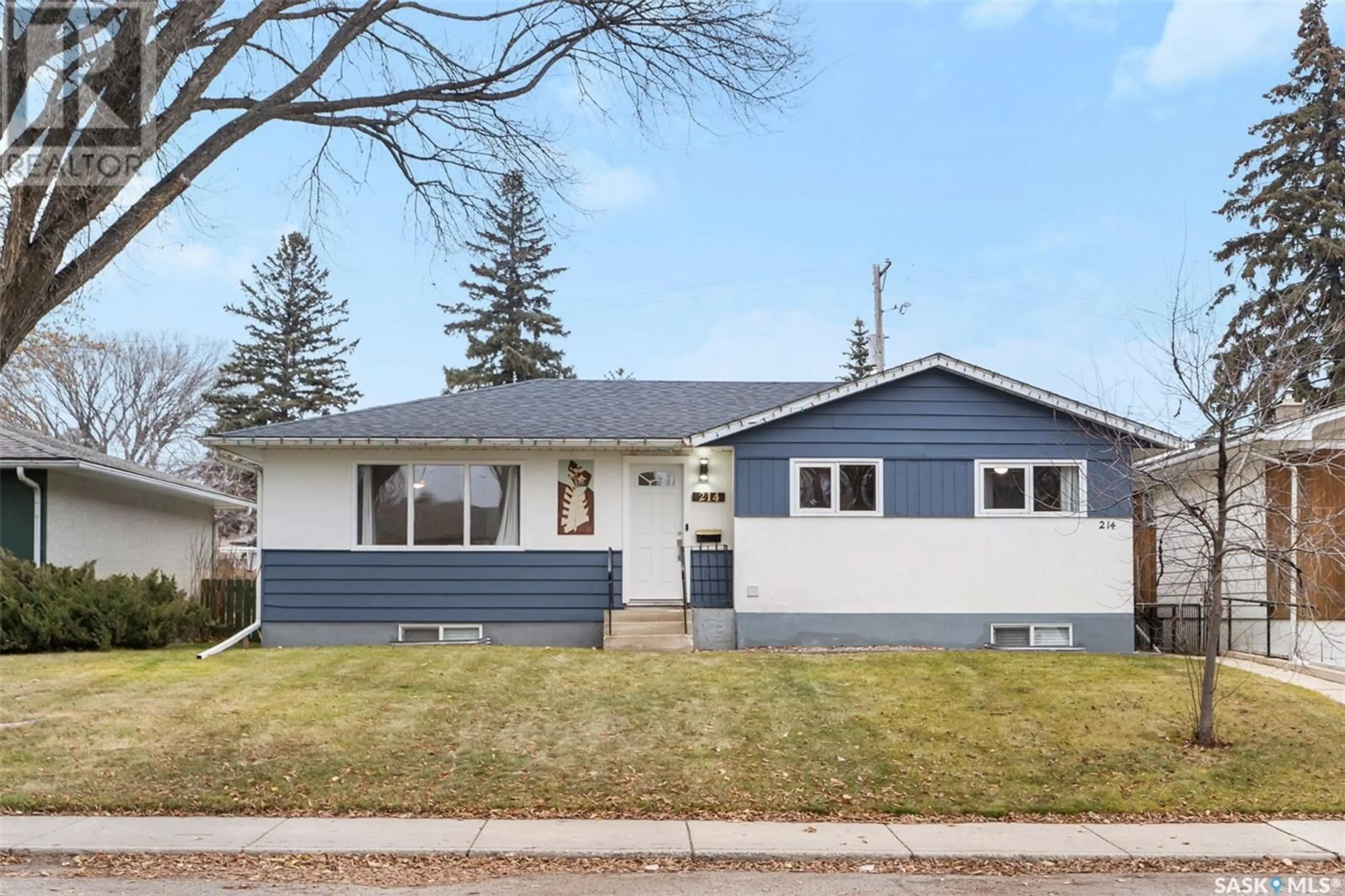 Home with vinyl exterior material, street for 214 X AVENUE, Saskatoon Saskatchewan S7L3J5