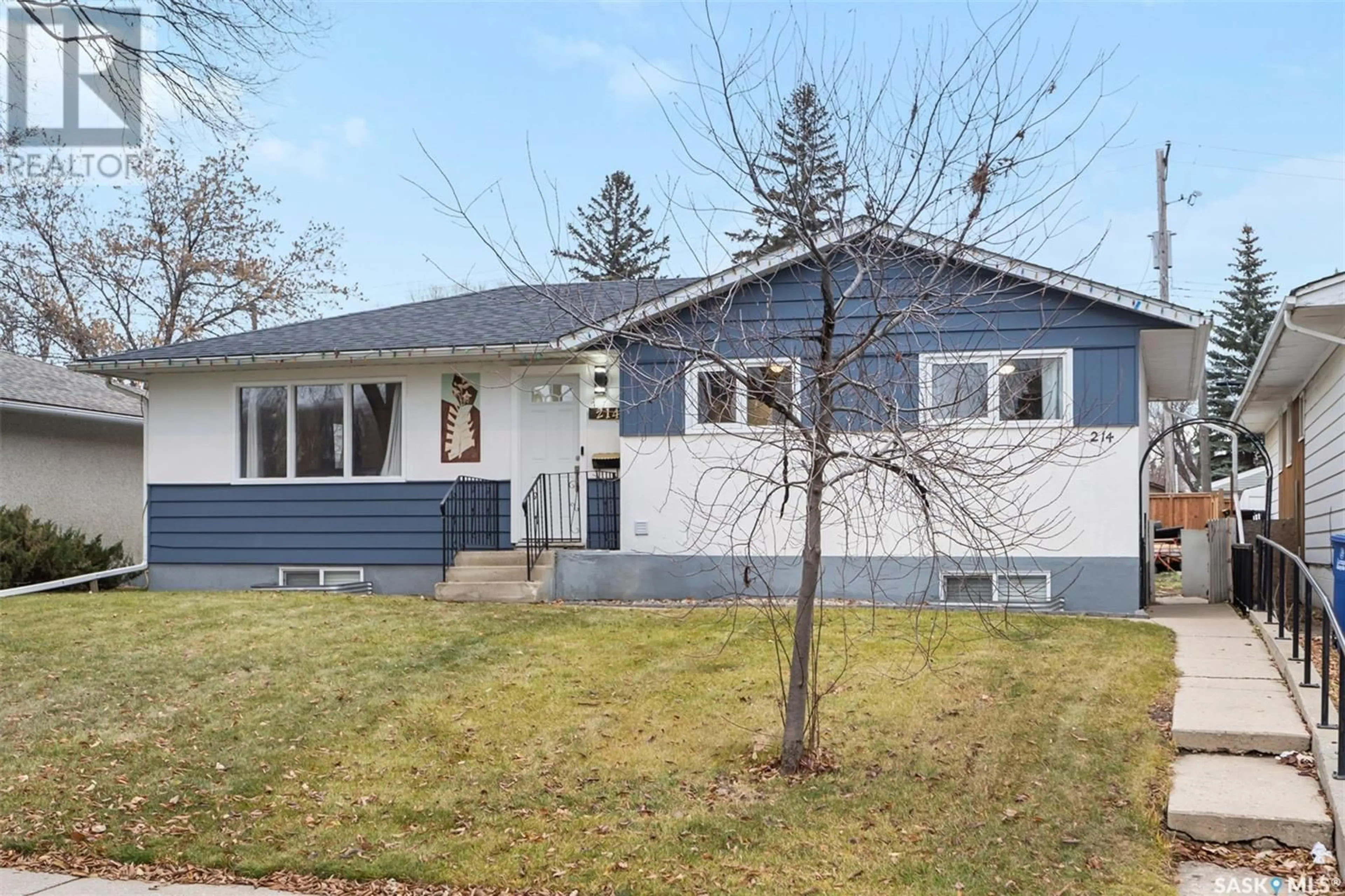 Home with vinyl exterior material, street for 214 X AVENUE, Saskatoon Saskatchewan S7L3J5