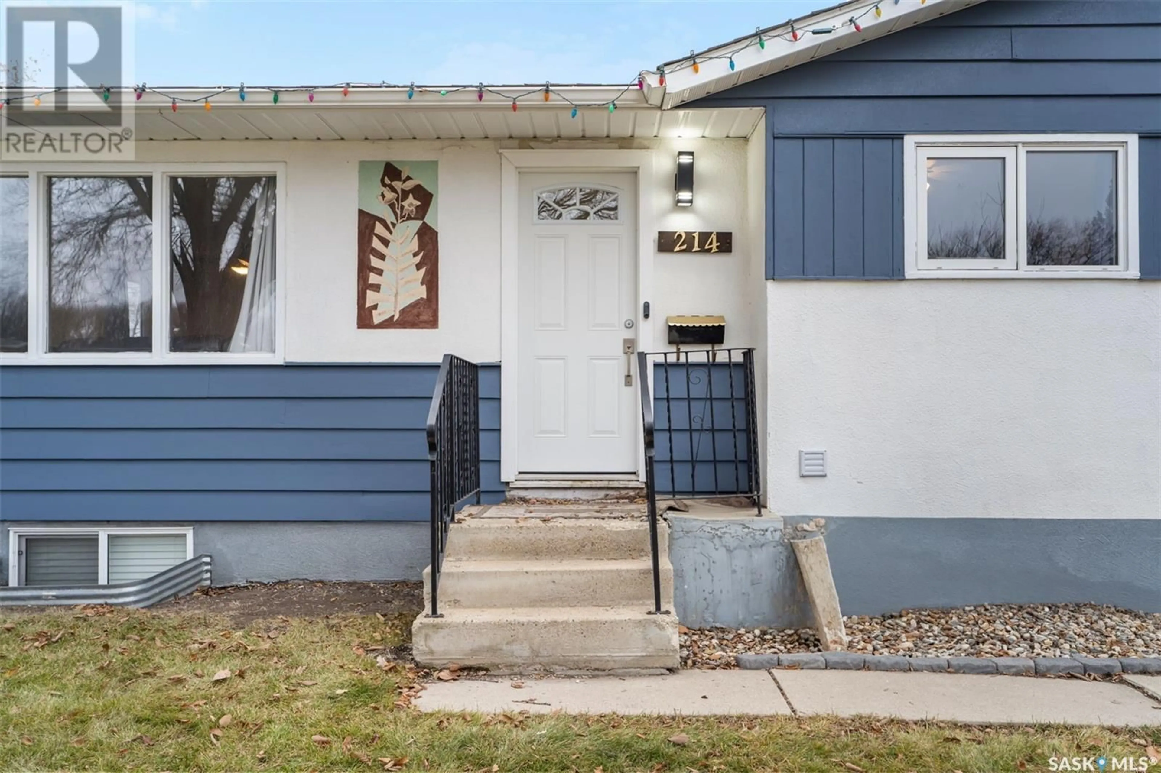 Home with vinyl exterior material, street for 214 X AVENUE, Saskatoon Saskatchewan S7L3J5