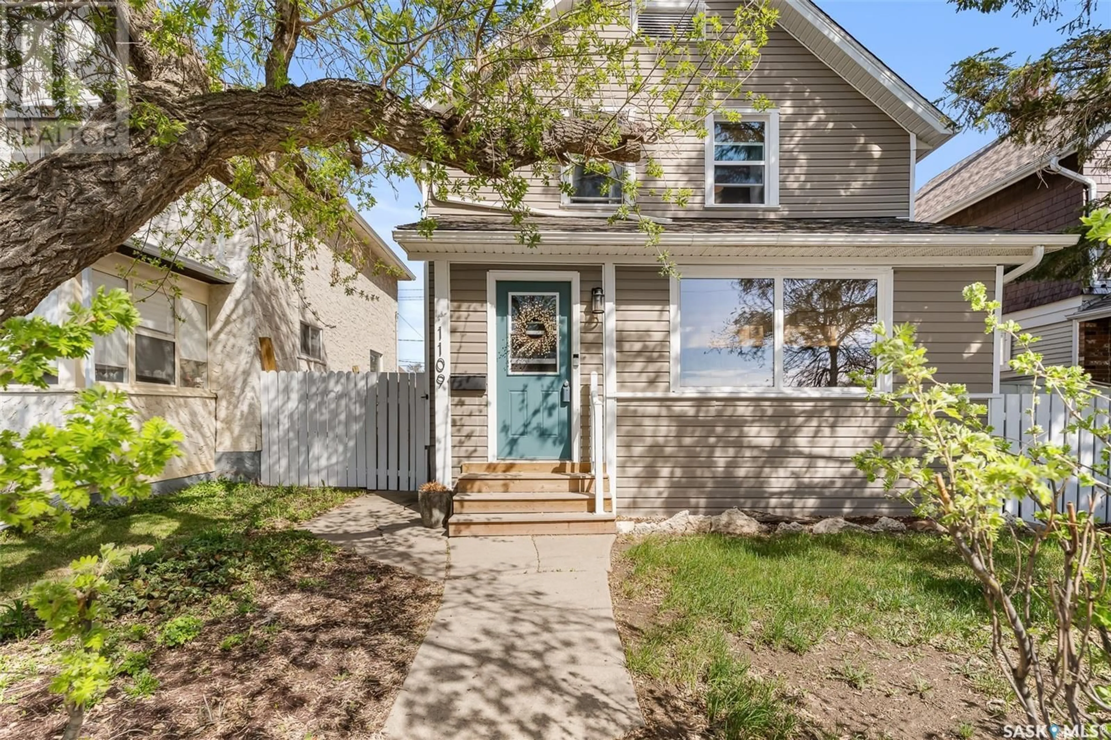 Home with vinyl exterior material, street for 1109 5TH AVENUE, Moose Jaw Saskatchewan S6H3Y6