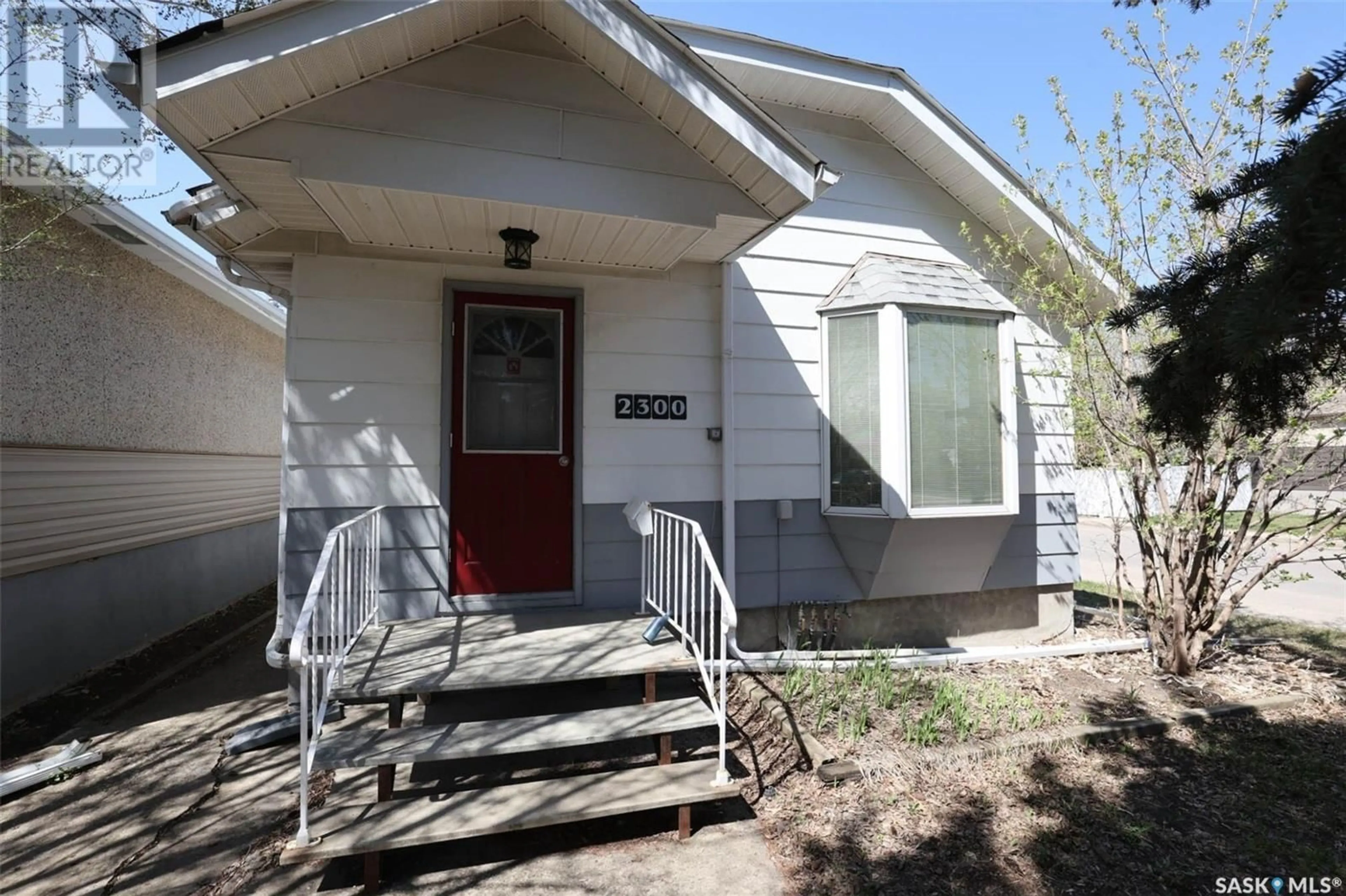 Home with vinyl exterior material, street for 2300 REYNOLDS STREET, Regina Saskatchewan S4N3N5