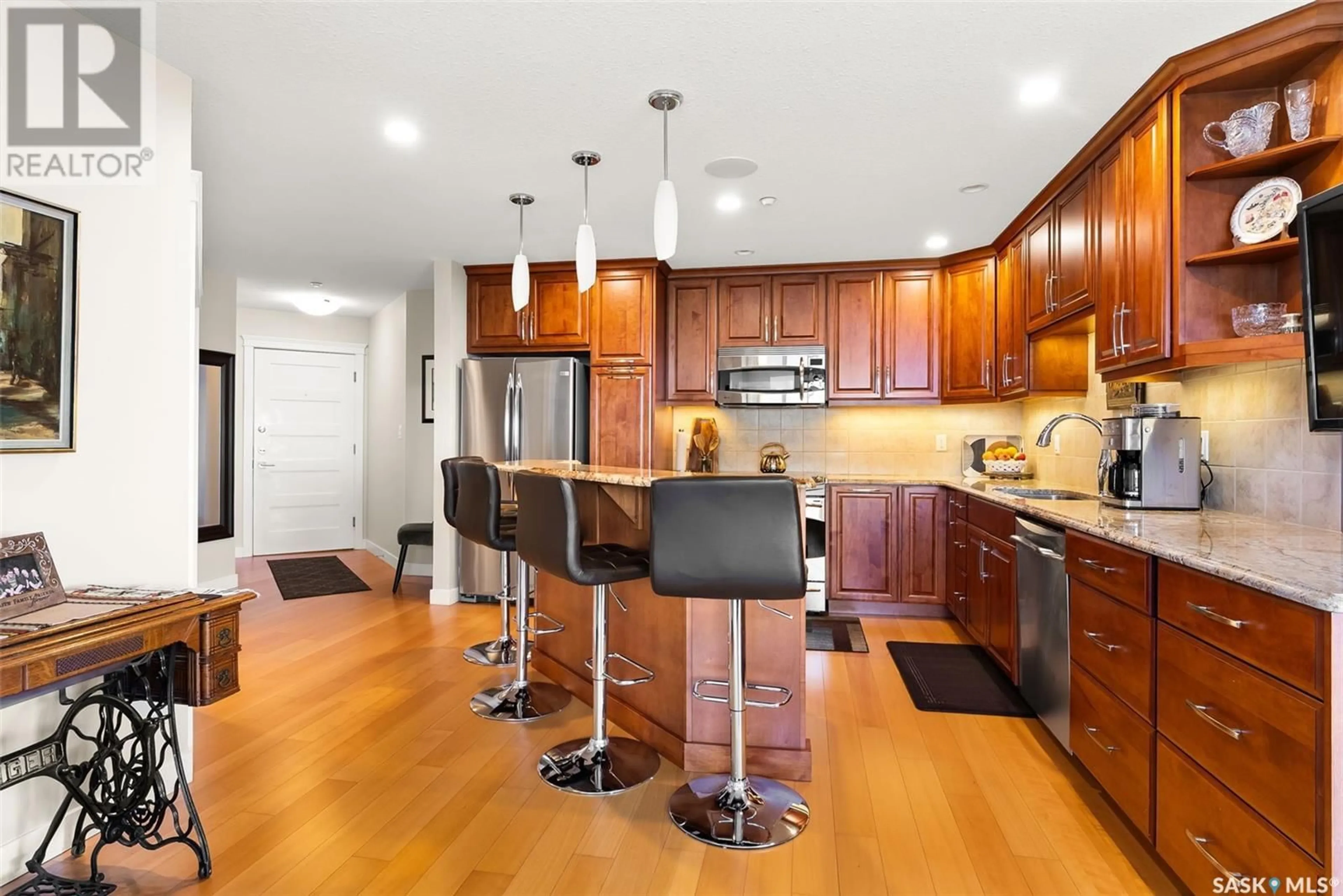 Open concept kitchen, wood/laminate floor for 702 2300 BROAD STREET, Regina Saskatchewan S4P1Y8