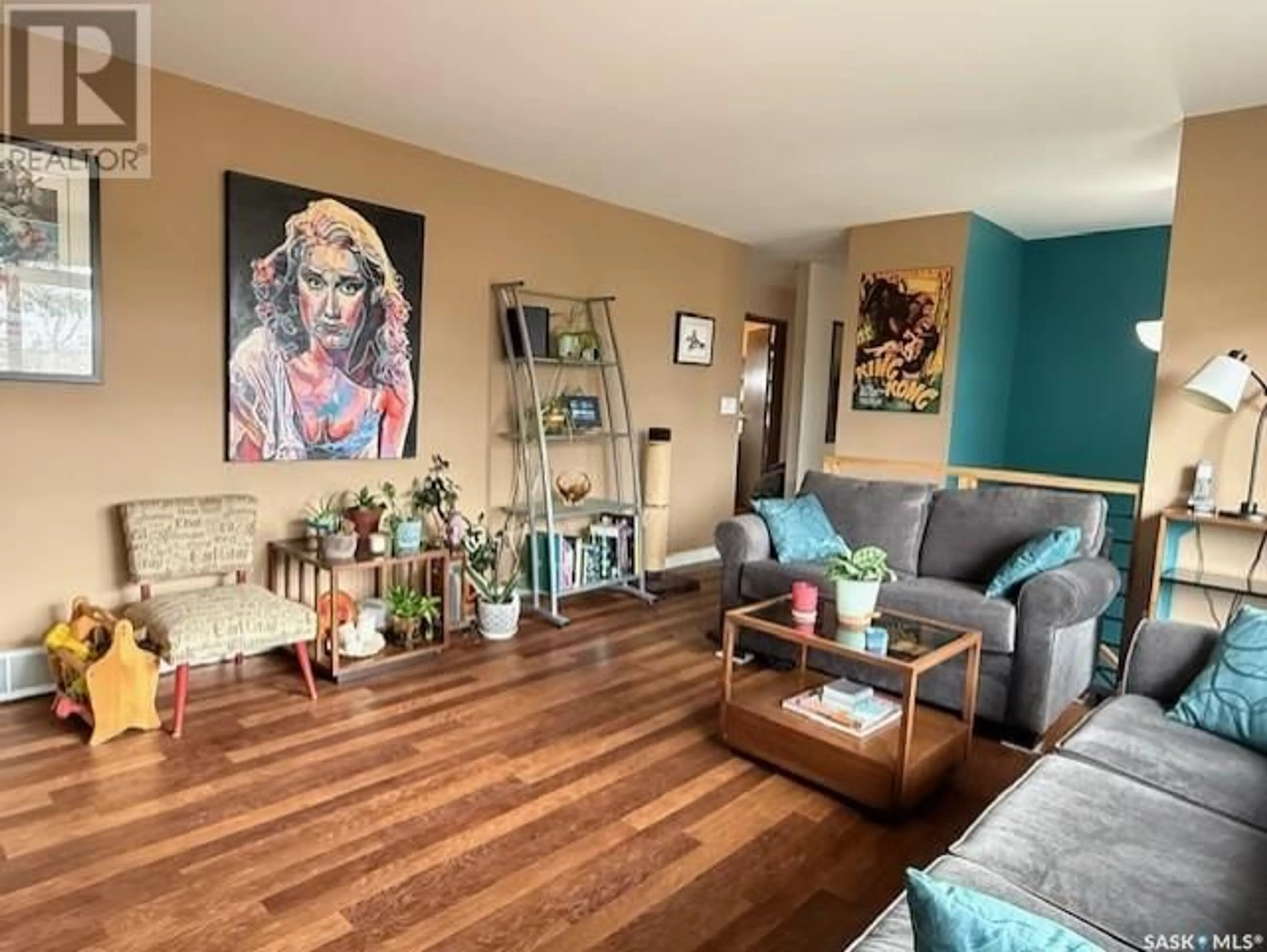 Living room with furniture, wood/laminate floor for 2062 RM OF CANA ACREAGE, Cana Rm No. 214 Saskatchewan S0A2P0