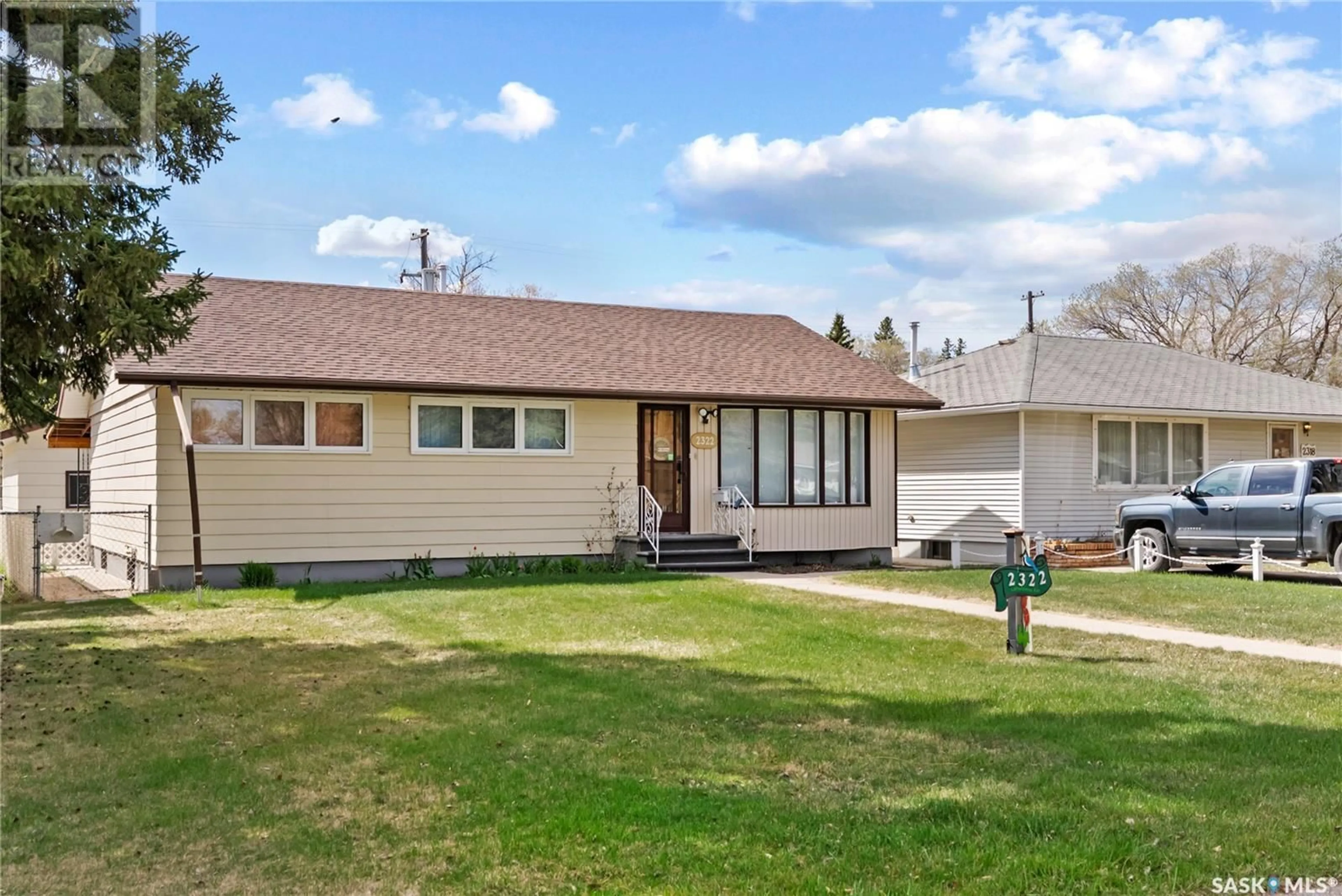 Home with vinyl exterior material, street for 2322 LANSDOWNE AVENUE, Saskatoon Saskatchewan S7J1G9