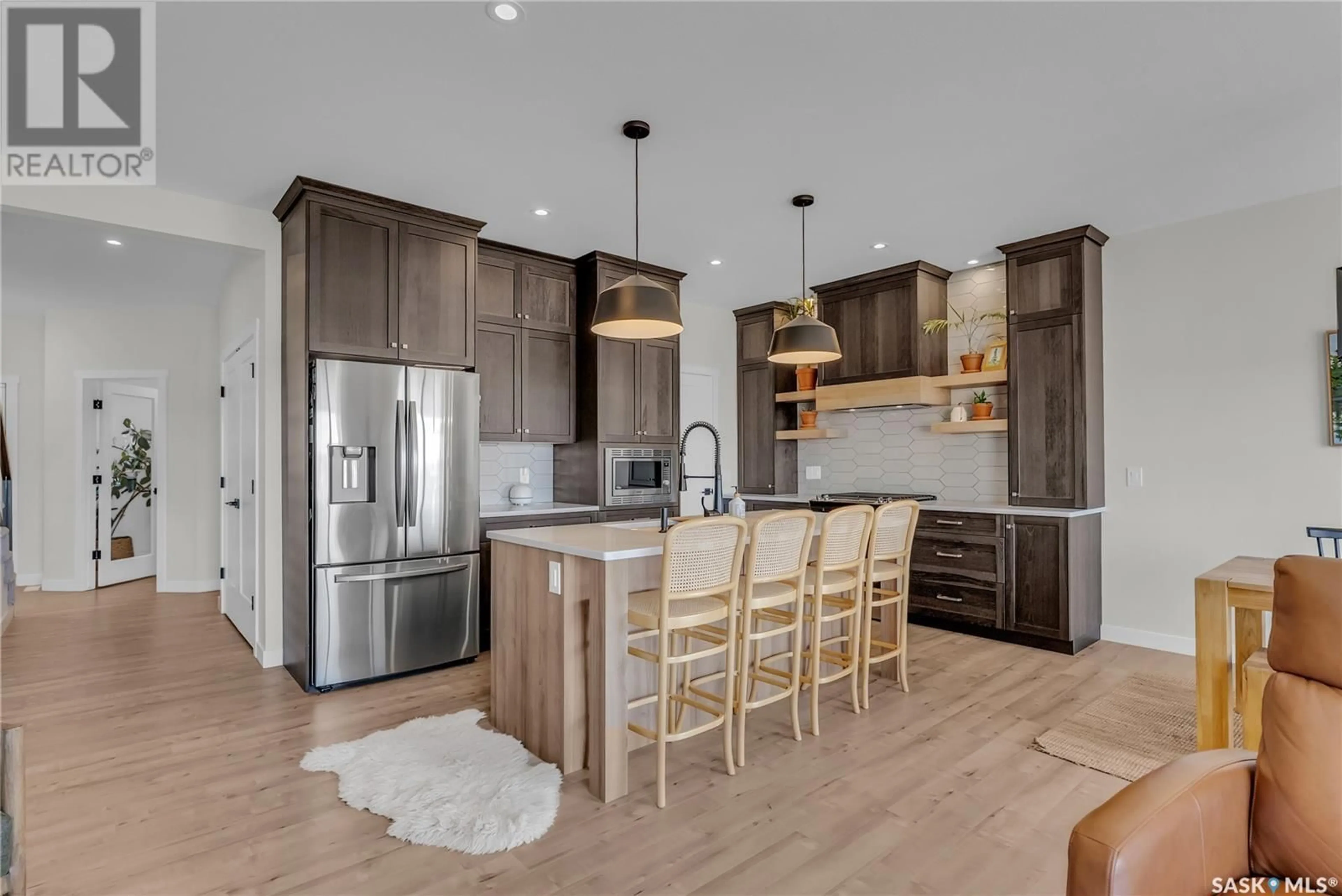 Open concept kitchen, wood/laminate floor for 102 KEITH WAY, Saskatoon Saskatchewan S7V0P4
