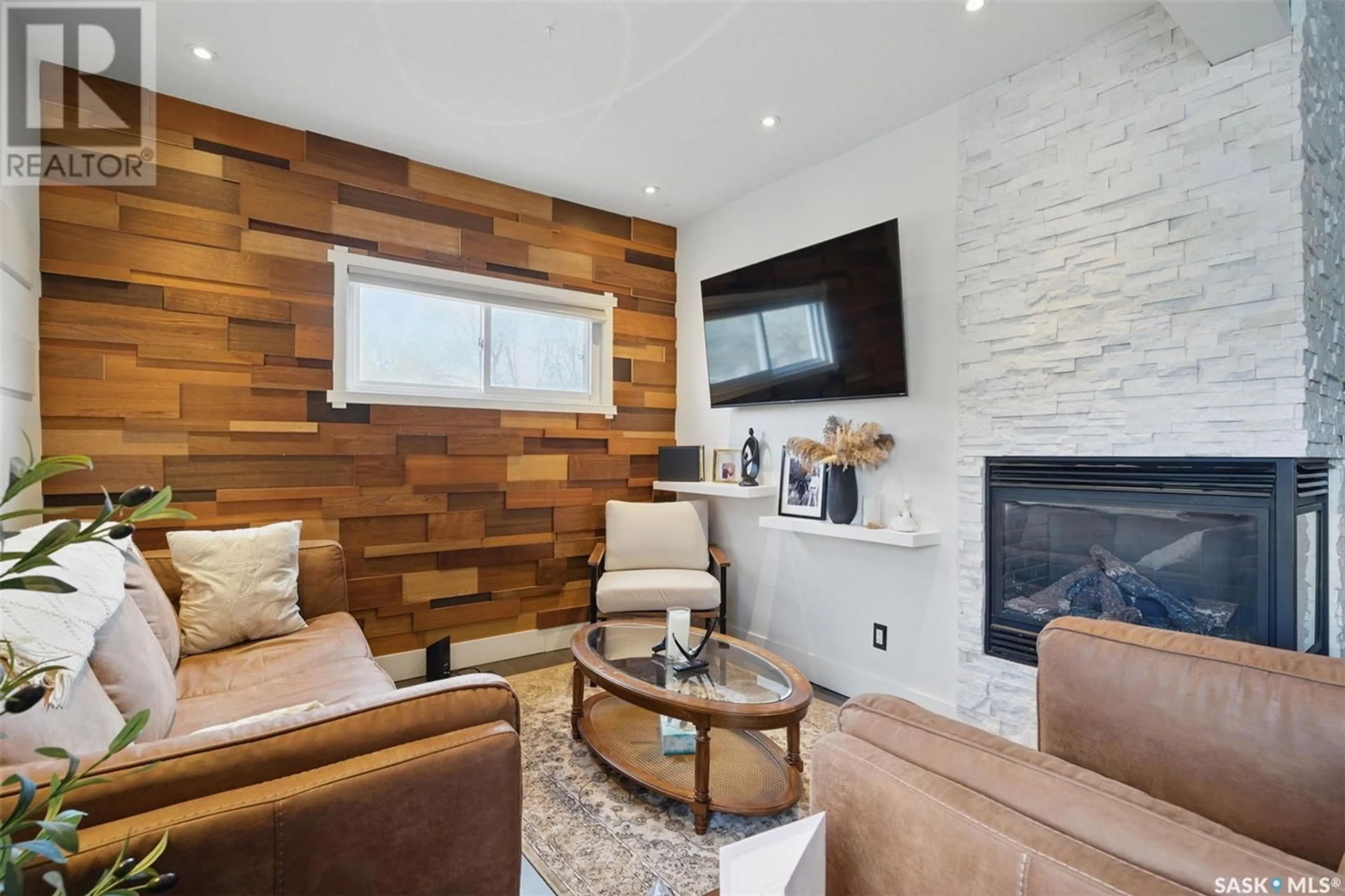 Living room with furniture, wood/laminate floor for 1221 6TH AVENUE, Saskatoon Saskatchewan S7K2T6