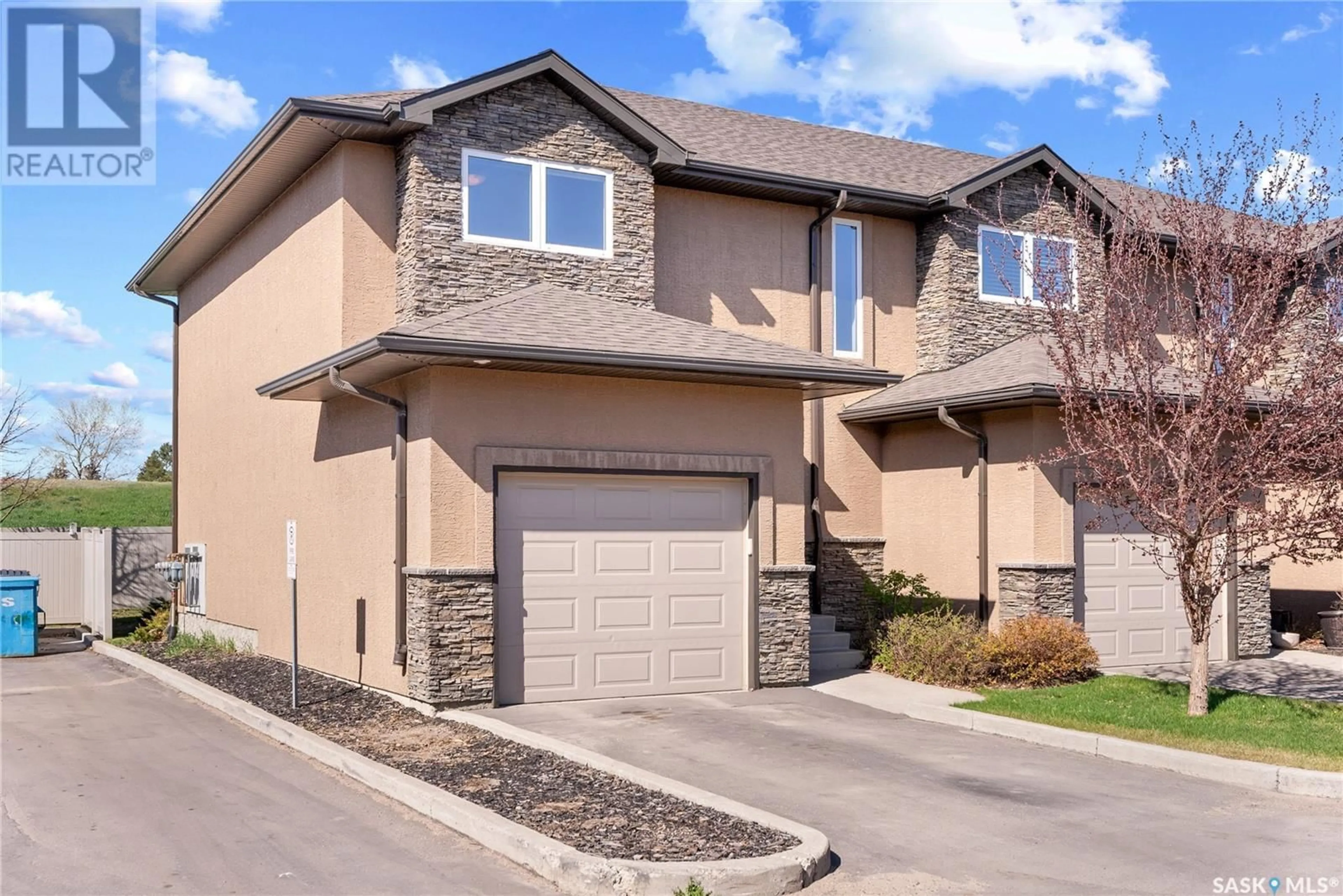 Home with brick exterior material, street for 18 502 REMPEL MANOR, Saskatoon Saskatchewan S7T0L7