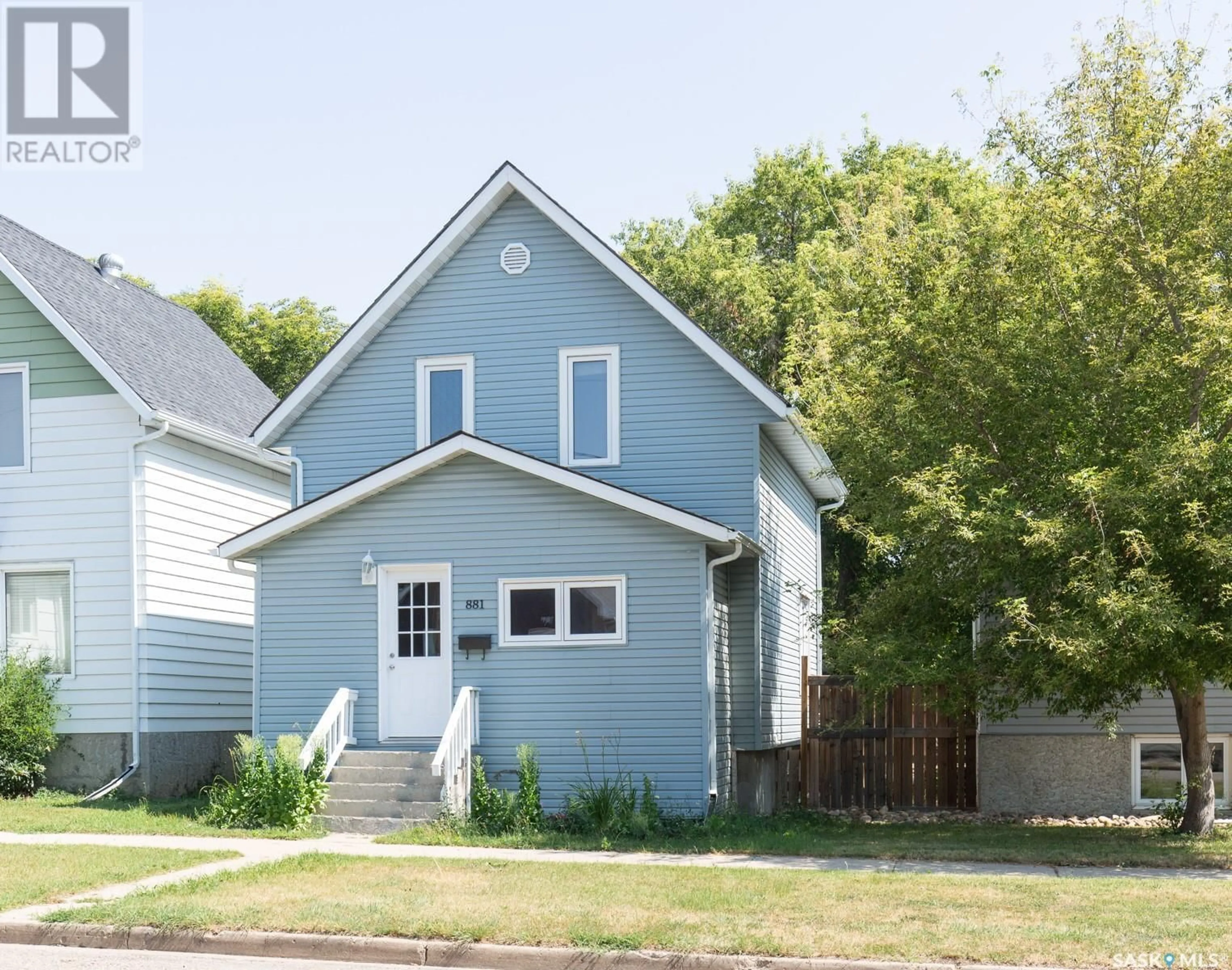 Home with vinyl exterior material, street for 881 ELGIN AVENUE, Moose Jaw Saskatchewan S6H4G6