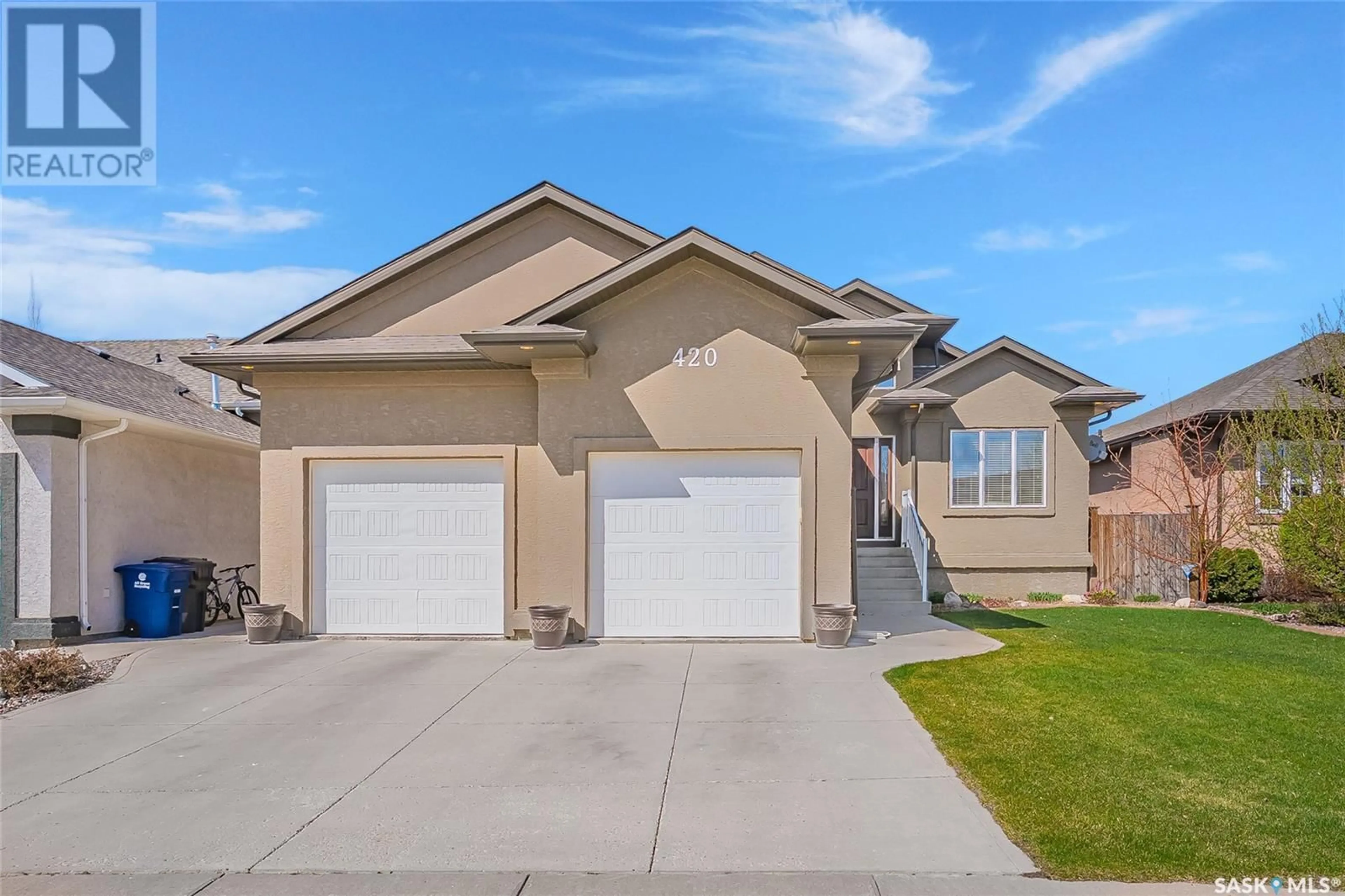 Home with vinyl exterior material, street for 420 WATSON WAY, Warman Saskatchewan S0K4S0