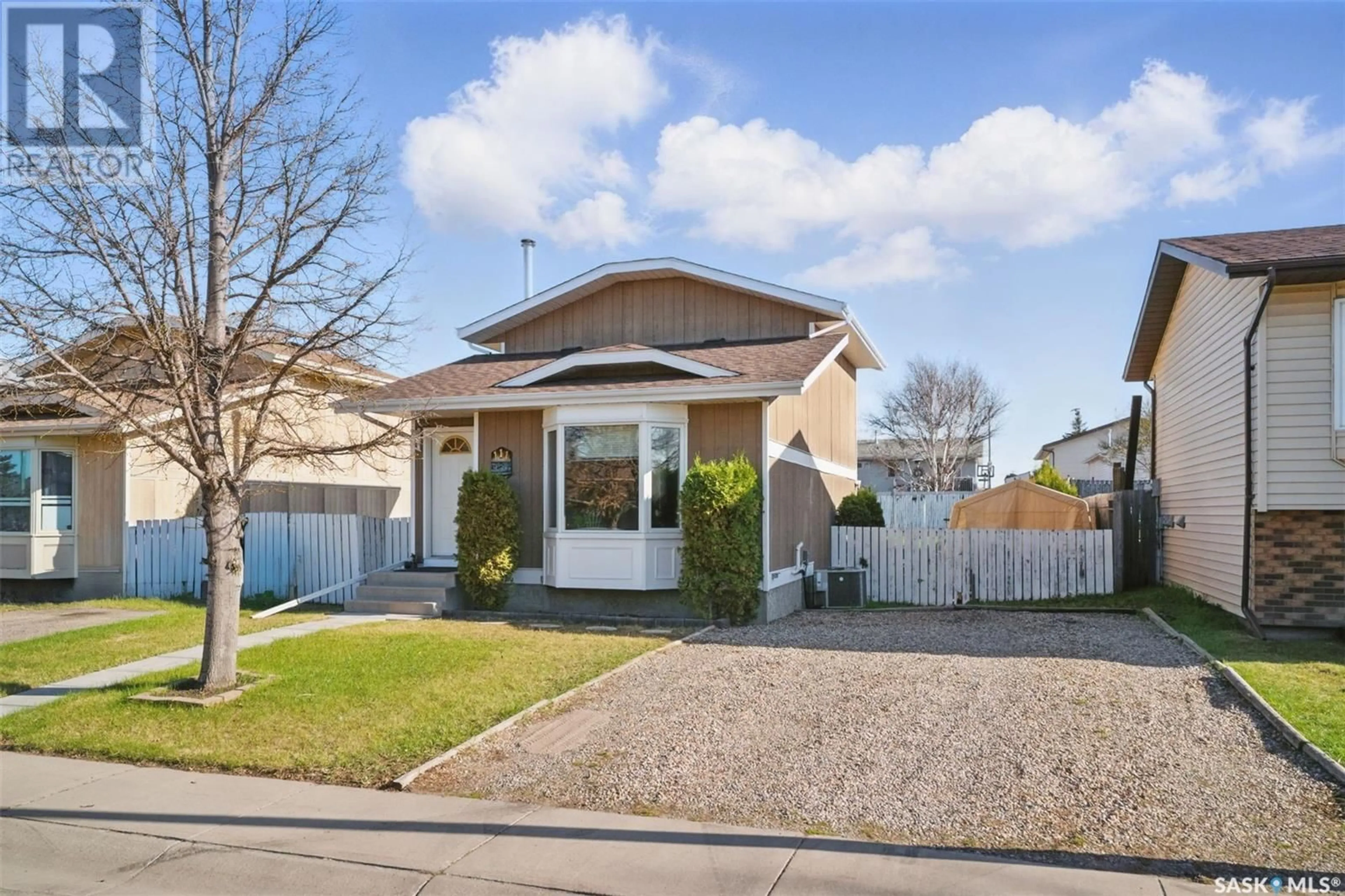 Home with vinyl exterior material, street for 111 CARTER CRESCENT, Saskatoon Saskatchewan S7L7K3