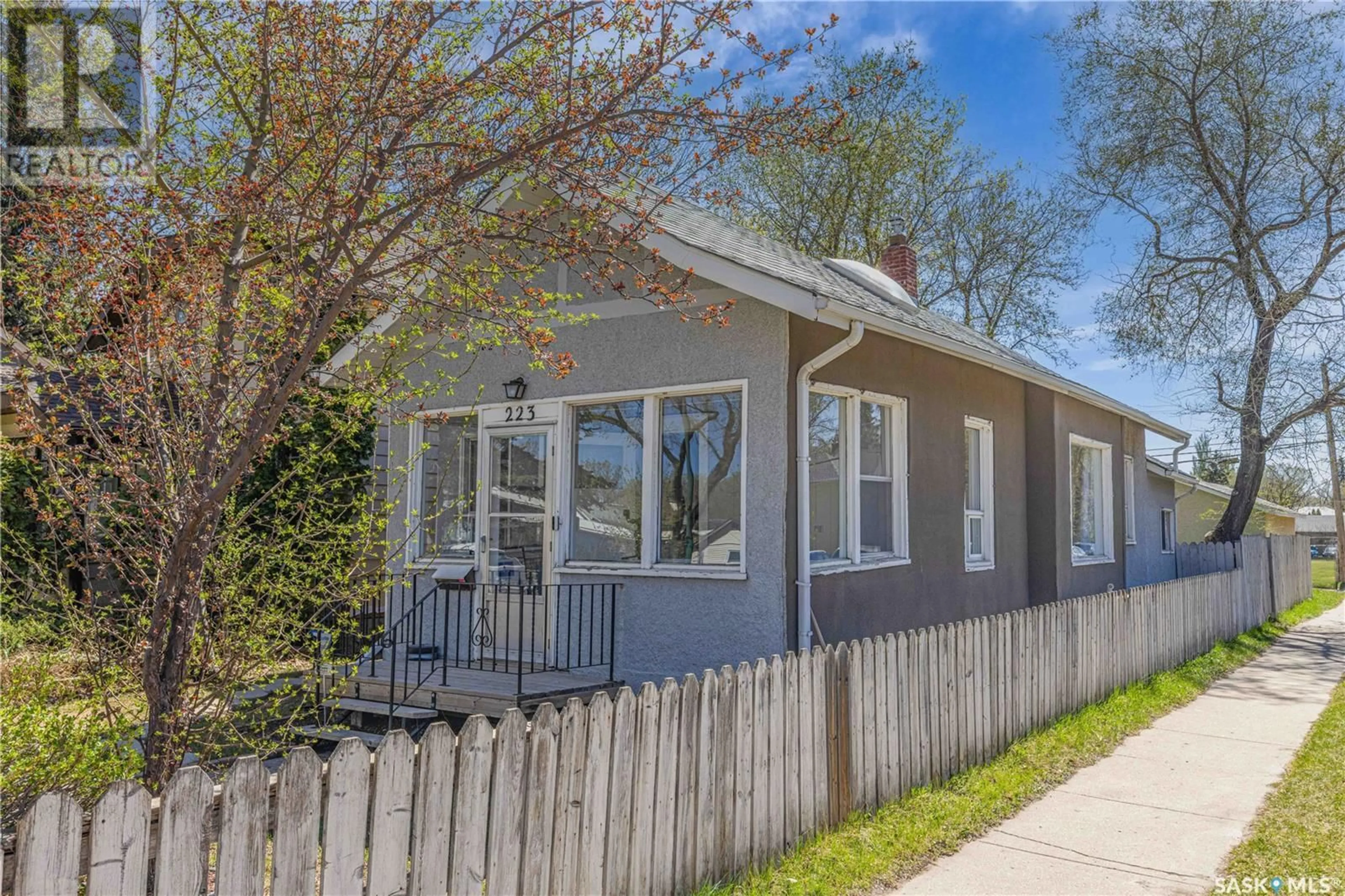 Home with vinyl exterior material, street for 223 31ST STREET, Saskatoon Saskatchewan S7L0P6