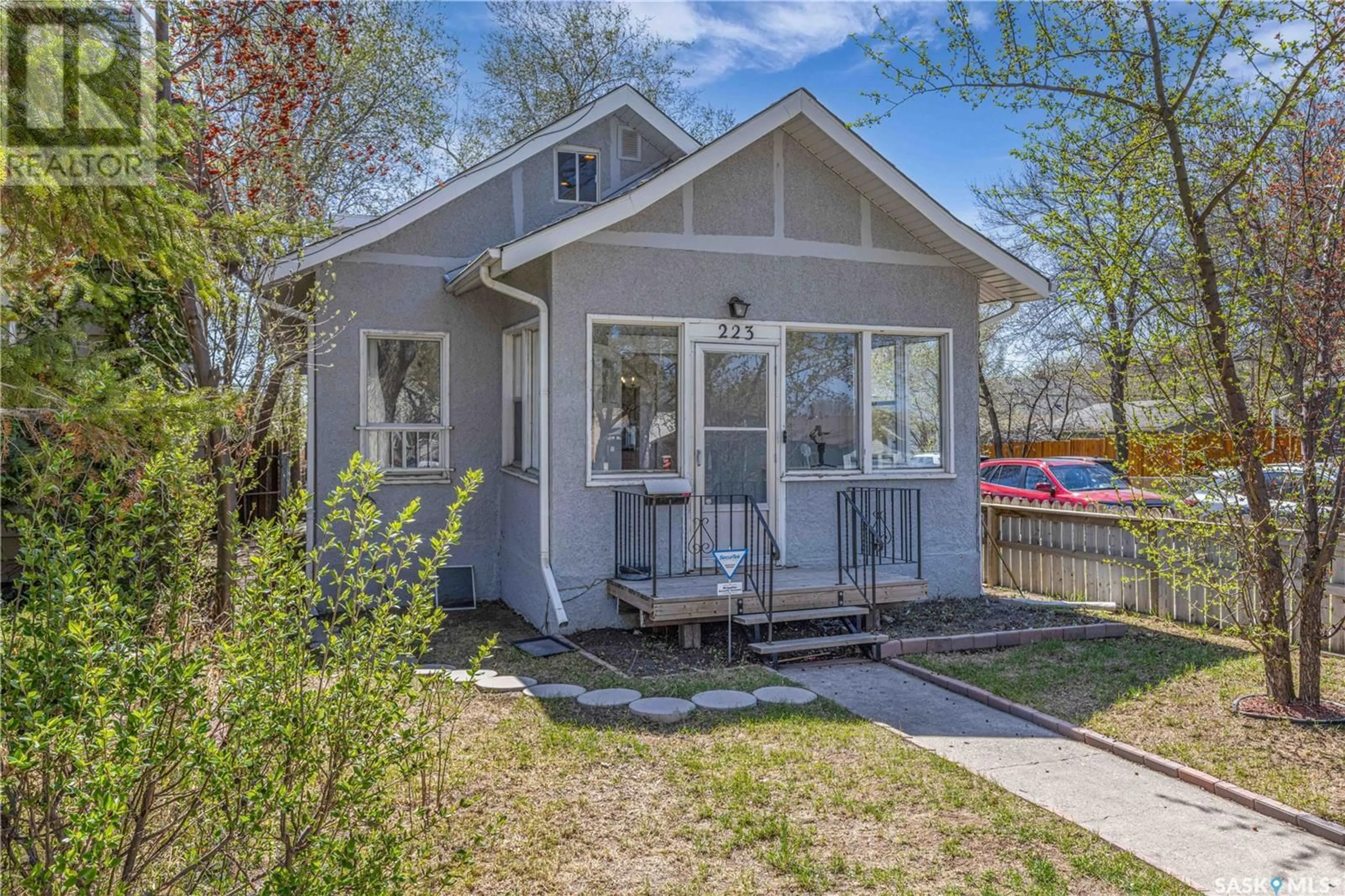 Home with vinyl exterior material, street for 223 31ST STREET, Saskatoon Saskatchewan S7L0P6