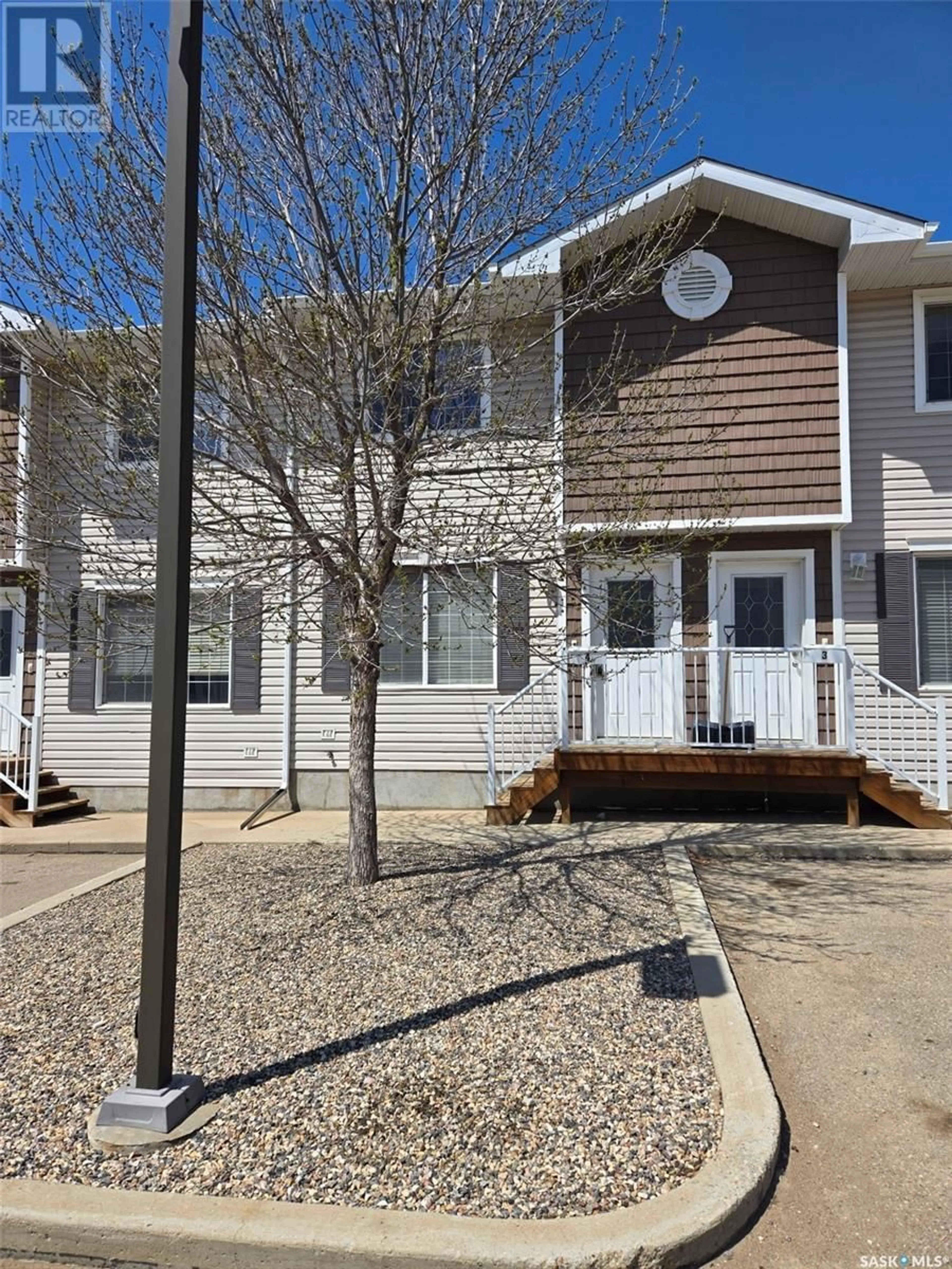 Home with vinyl exterior material, street for 4 - 1621 FIRST STREET, Estevan Saskatchewan S4A2X4