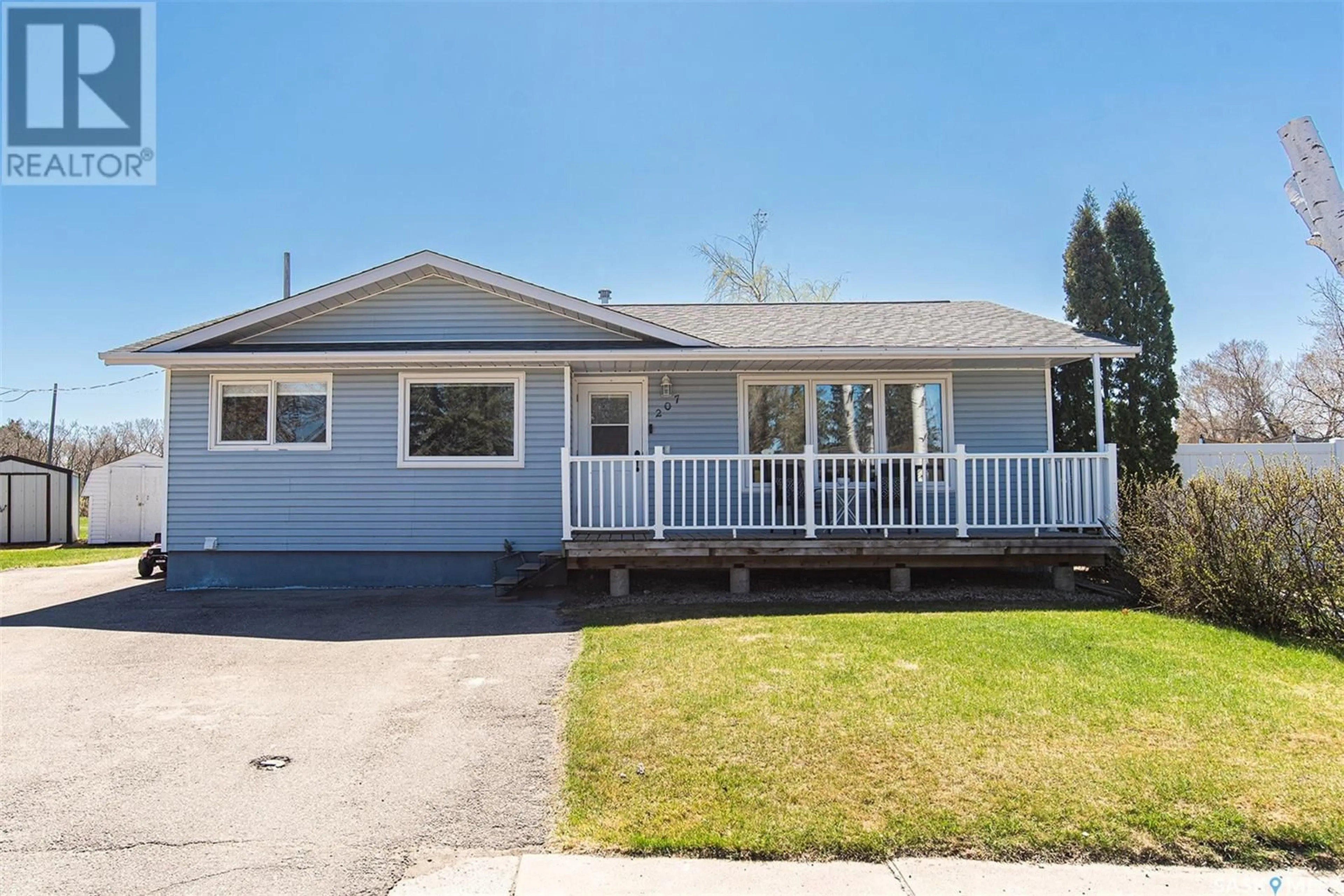 Home with vinyl exterior material, street for 207 BROOKDALE PLACE, Wynyard Saskatchewan S0A4T0
